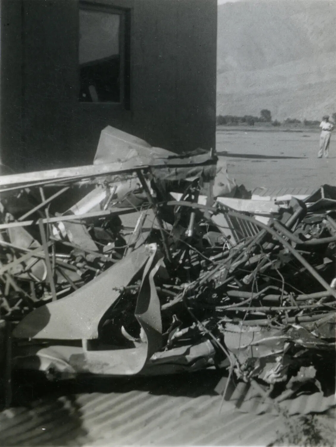 Pile of Wreckage Debris Beside Metal Building, Pacific Theater, WWII Era