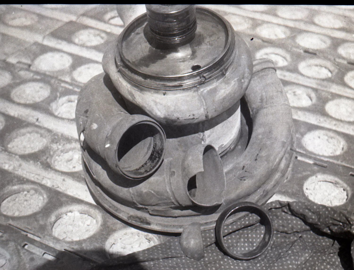 Close-Up Study of an Unidentified Metal Mechanical/Military Component