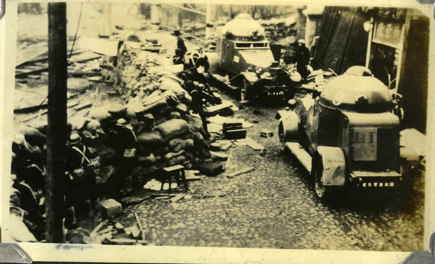 Fortified Street Position with Sandbag Barricade and Armored Cars, c. 1930s