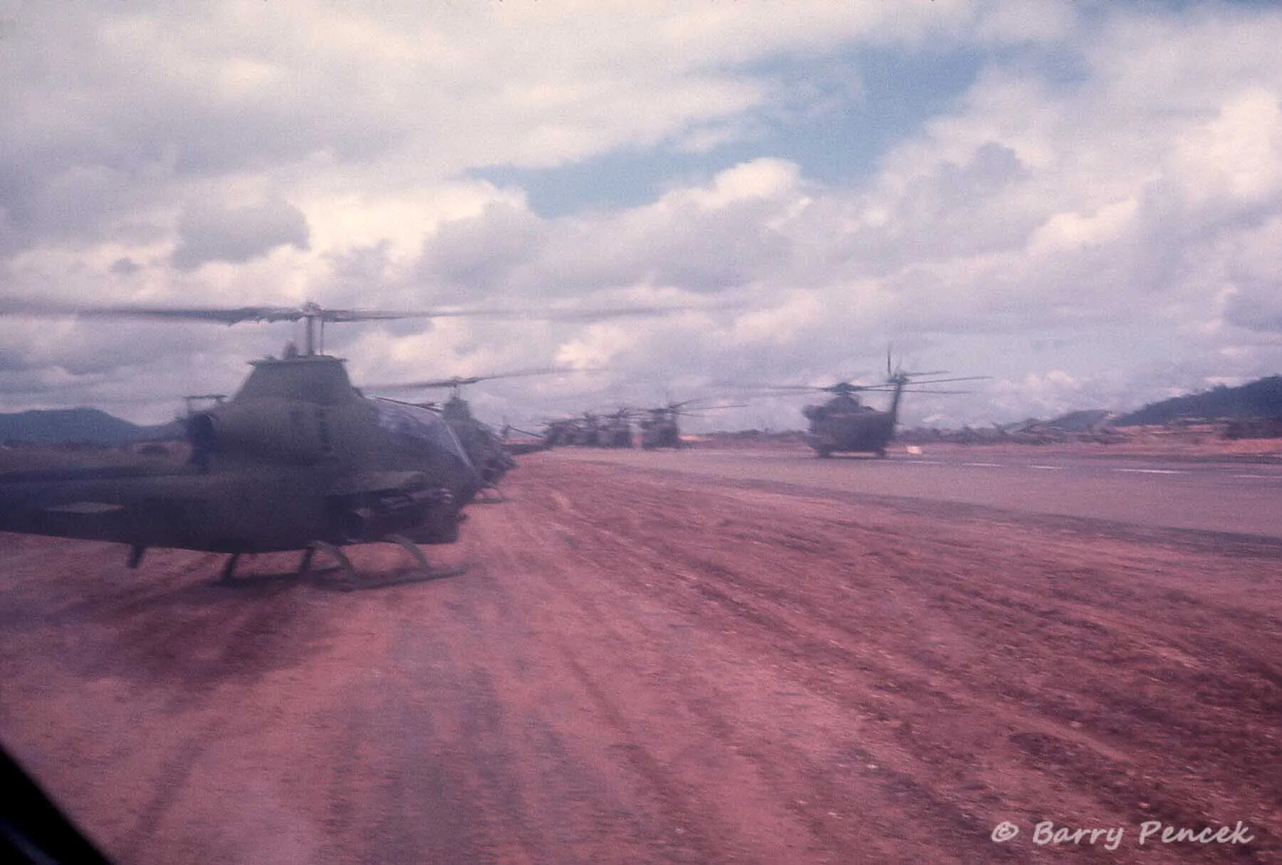 AH-1 Cobra Gunships and CH-47 Chinooks on Airfield Apron, South Vietnam