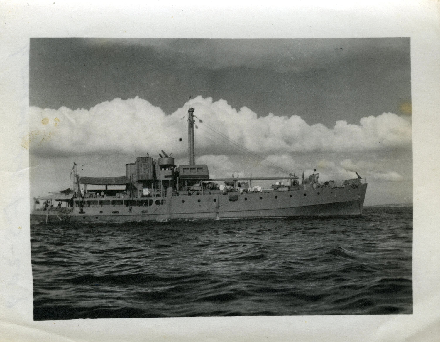 Broadside View of U.S. Navy Auxiliary Vessel at Anchor, Pacific Theater, 1945