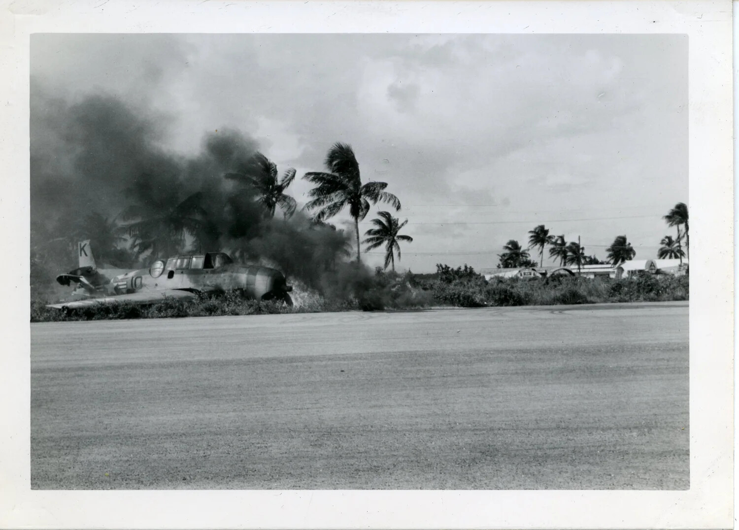 Burning Aircraft on the Flight Line at a Pacific Island Airfield, Guam