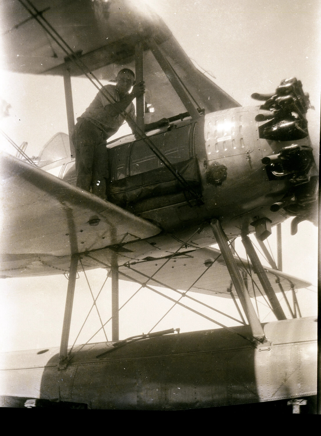 US Navy Sailor Boarding a Biplane Floatplane, Asiatic Fleet, China Station, 1930s