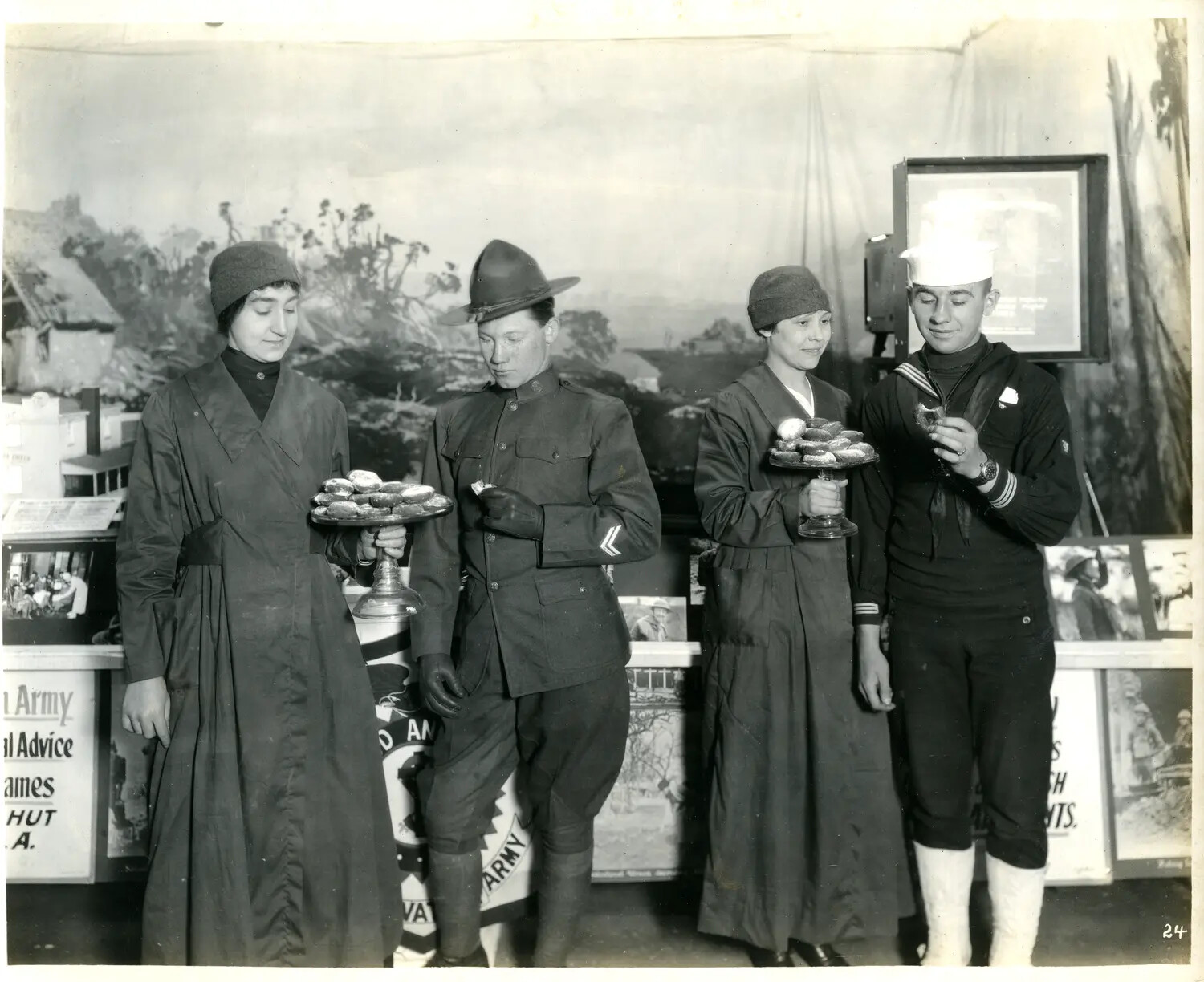 Salvation Army Volunteers Serving Doughnuts to a Soldier and Sailor, WWI-Era Exposition Booth, Ohio, c. 1917-1918