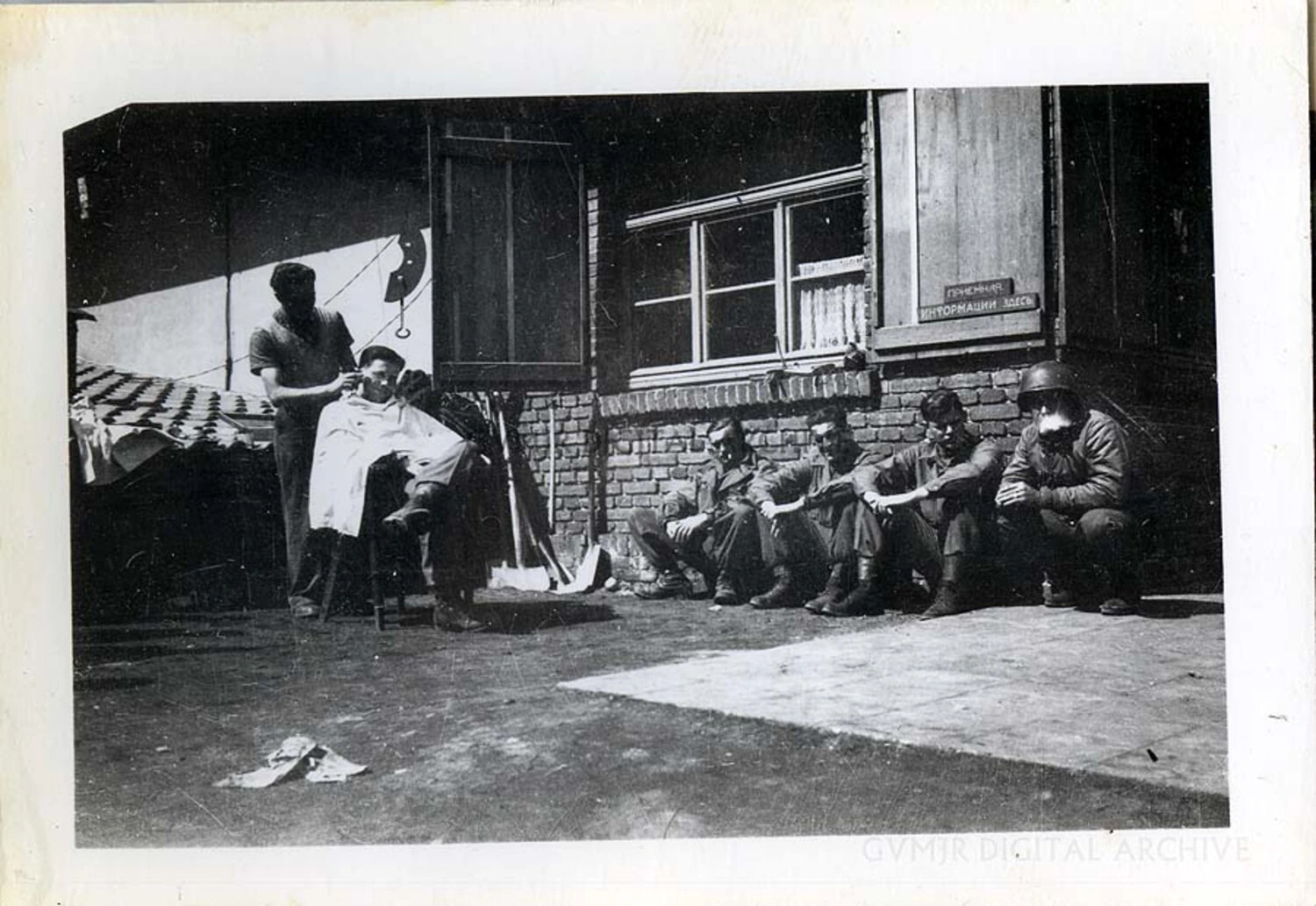 Impromptu Outdoor Barbershop with Soldiers Awaiting Haircuts, WWII European Theater