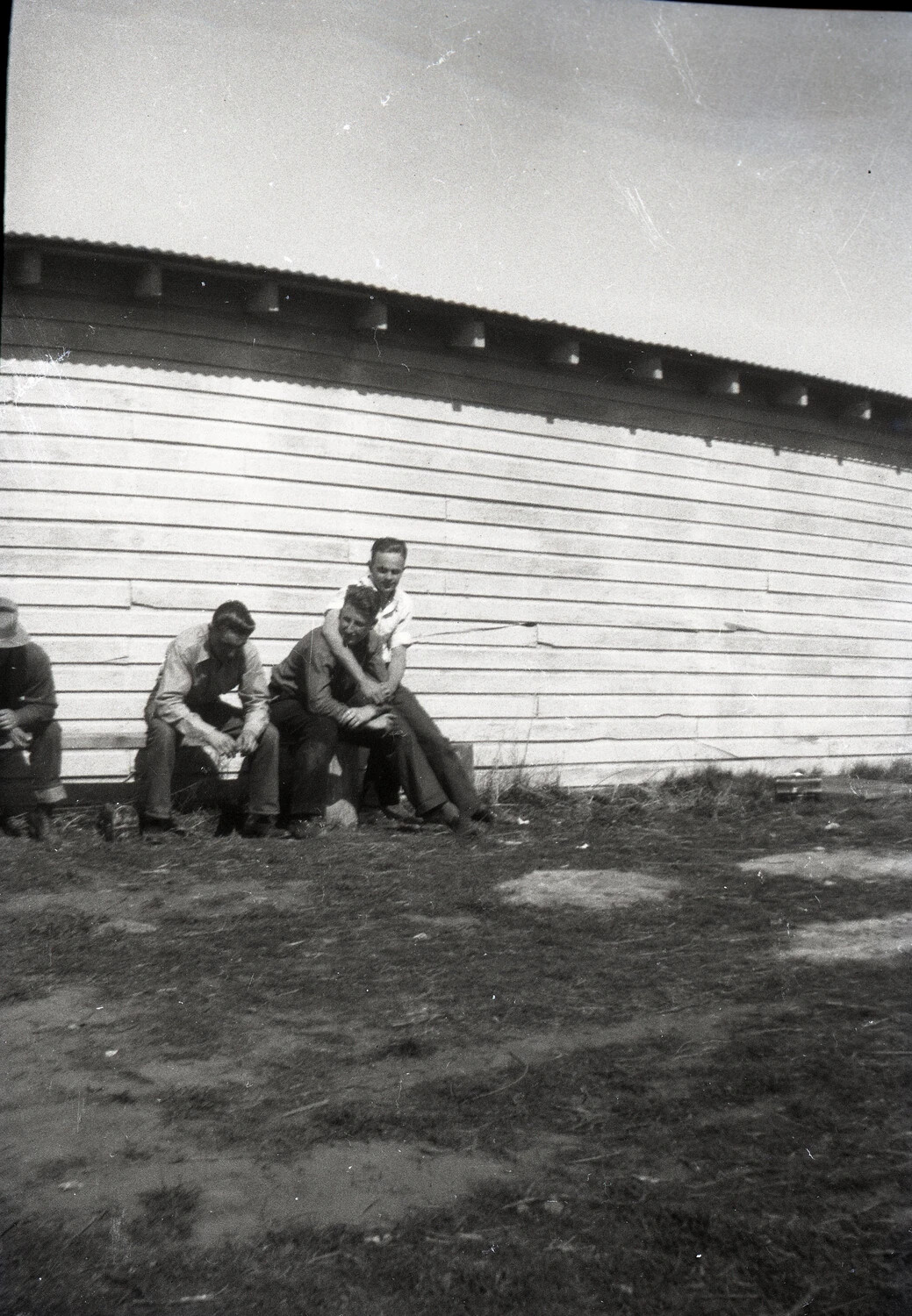 Group of Men Resting Outside Wooden Building, Bremerhaven Training Collection, WWII/Postwar Era