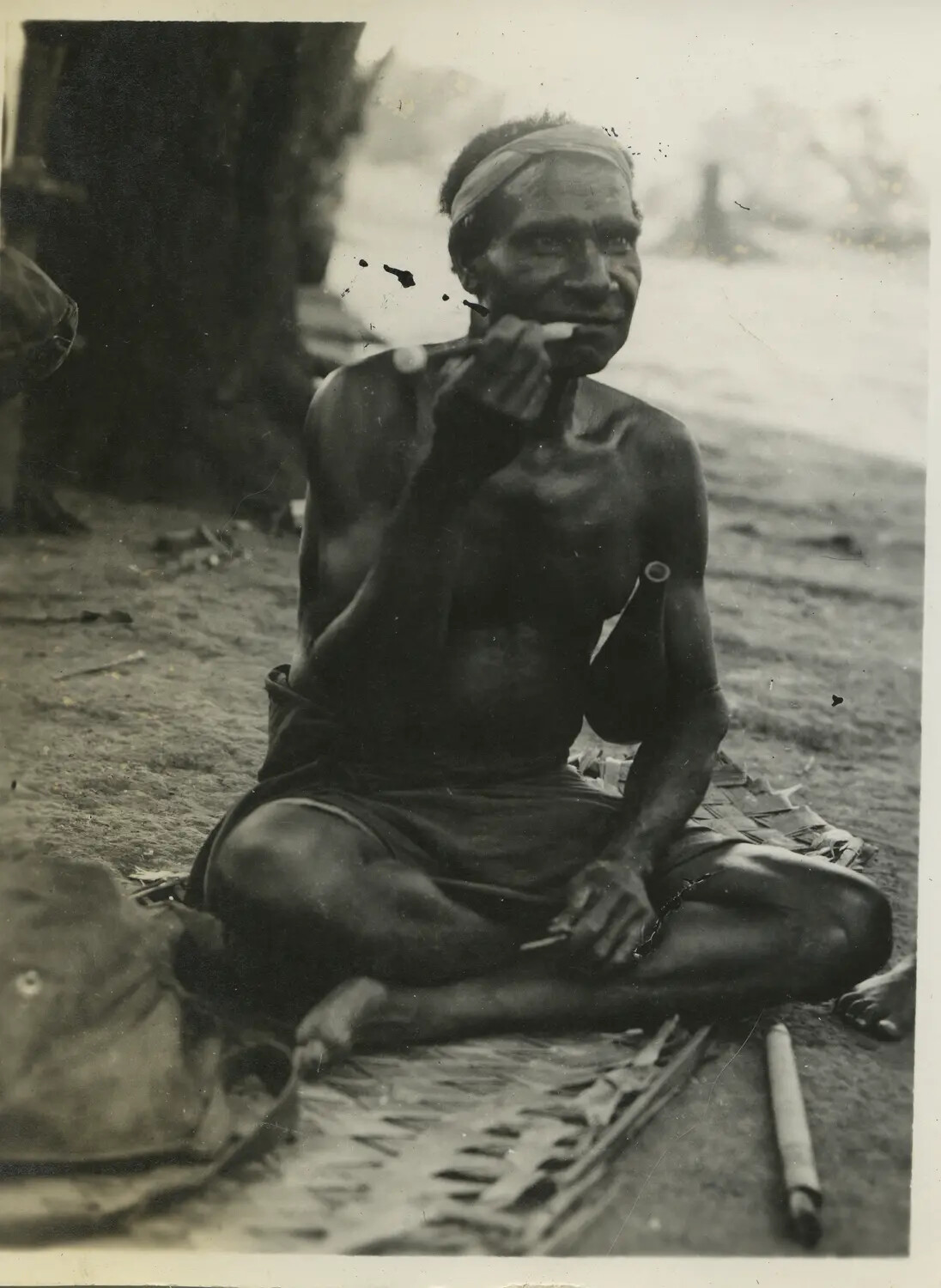 Local Islander Man Smoking, Southwest Pacific Area, World War II Era