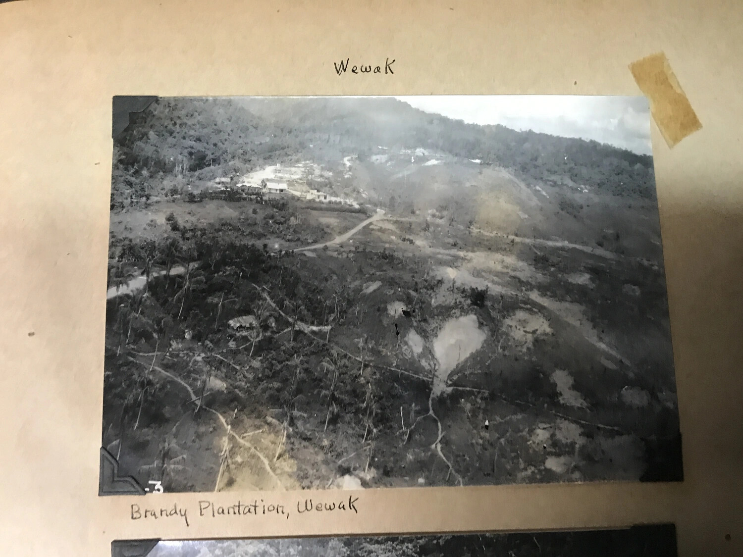 Album Page: 'Brandy Plantation, Wewak' - Elevated Aerial View of Plantation Settlement
