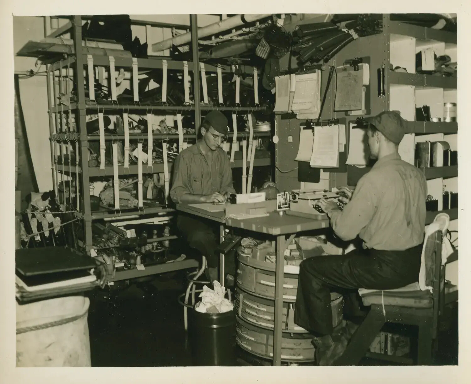 Sailors Working in an Equipment Storeroom Aboard USS Petrof Bay (CVE-80)