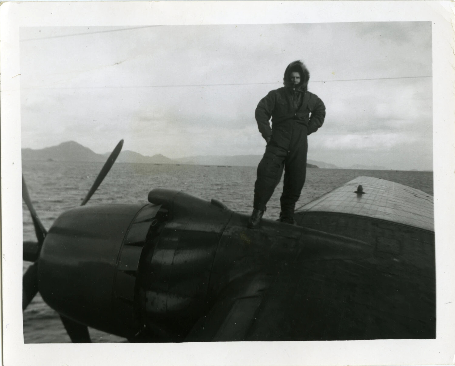 Naval Aviator in Winter Flight Gear Atop Fighter Aircraft, Korean War Era