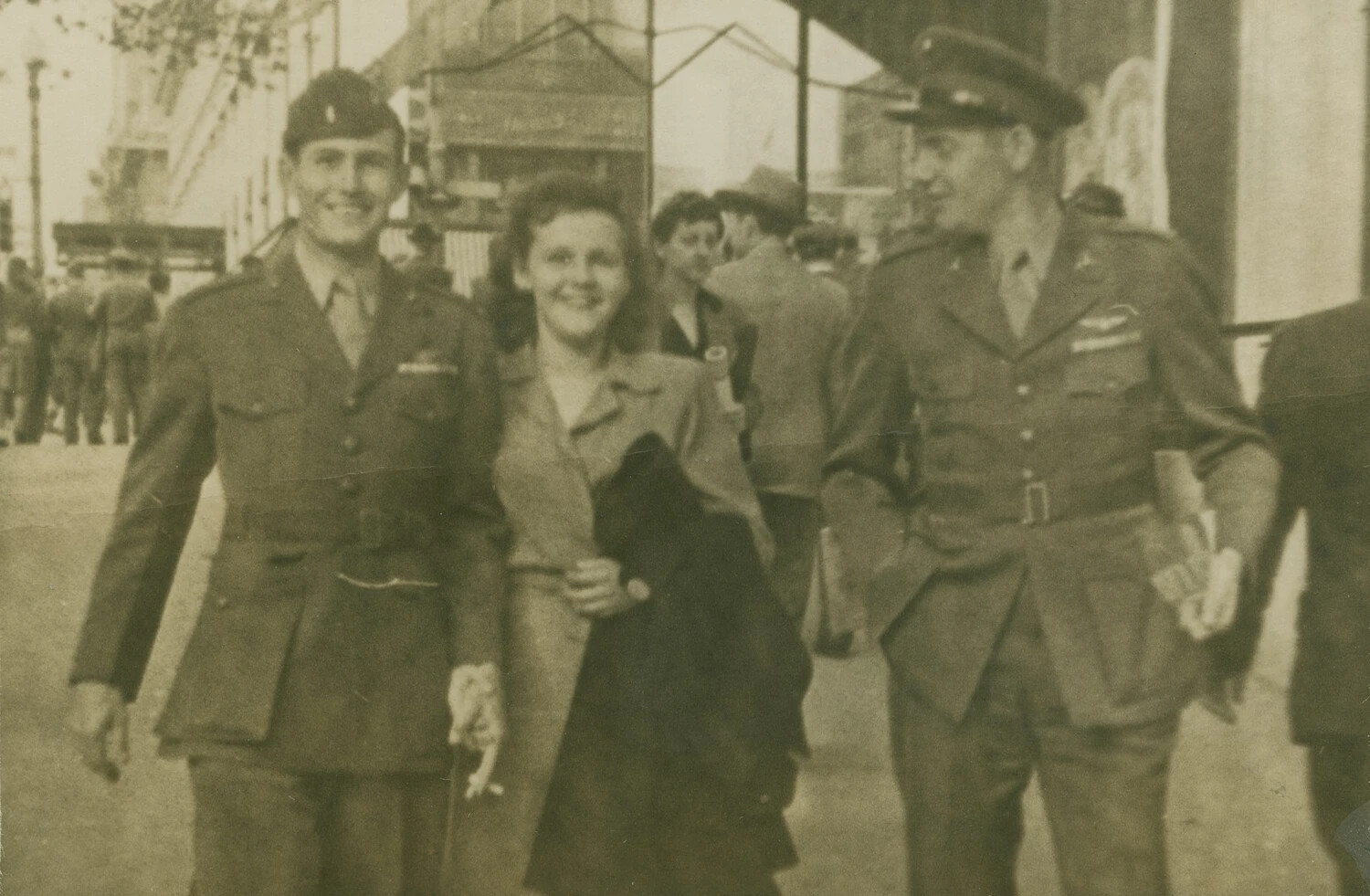 Two U.S. Army Air Forces Officers with a Woman on a City Street, World War II Era