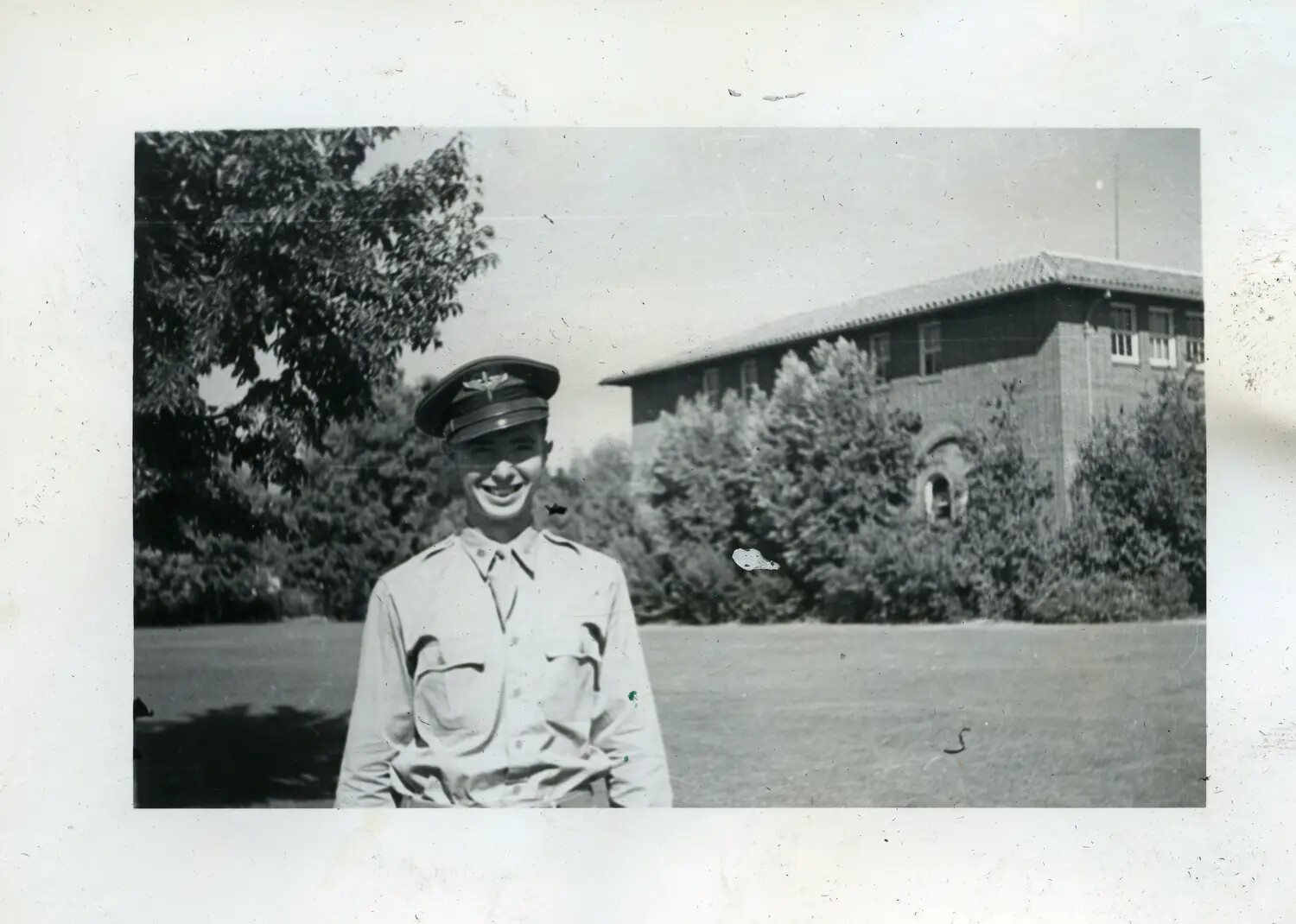 Portrait of a Military Aviator or Cadet in Front of Mission-Style Building, Late 1930s/Early 1940s