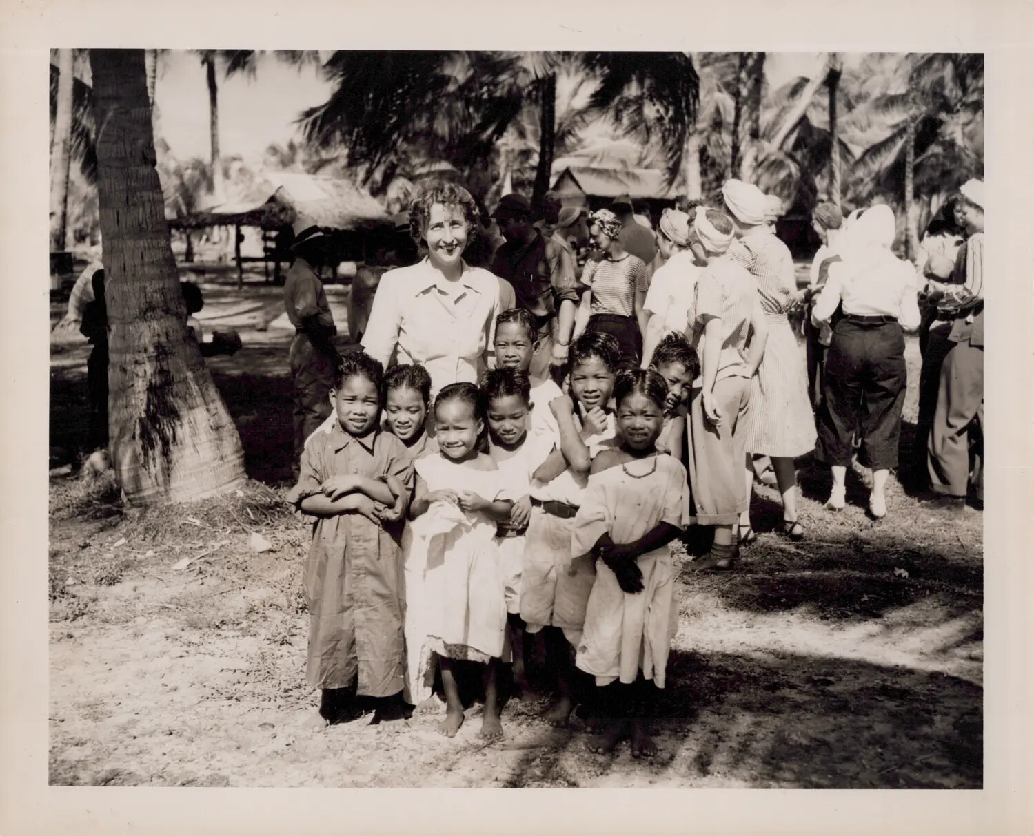 American Servicewoman with Local Children, Pacific Village Scene