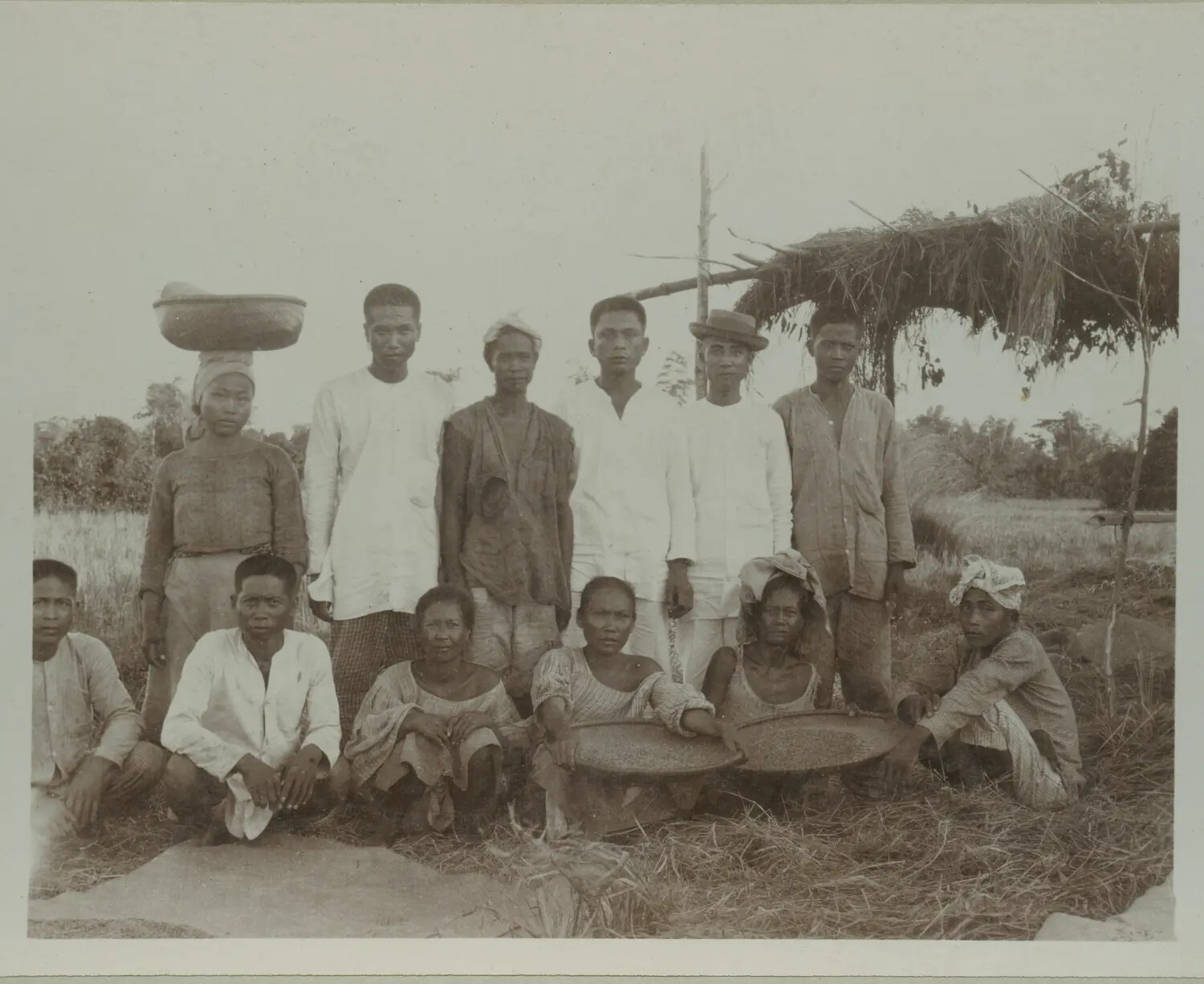 Group Portrait of Filipino Rice Farm Laborers with Winnowing Trays, Philippines, circa 1890s-1900s