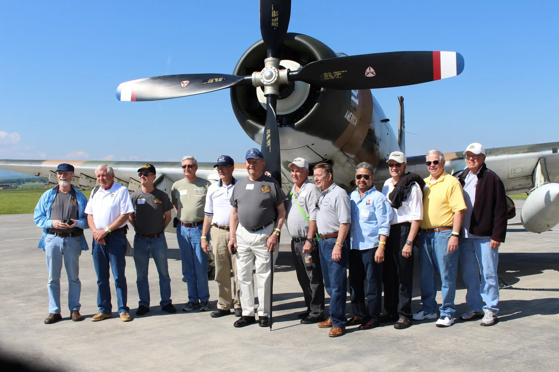 Group Portrait Beneath A-1 Skyraider Propeller (Burst Sequence Frame)