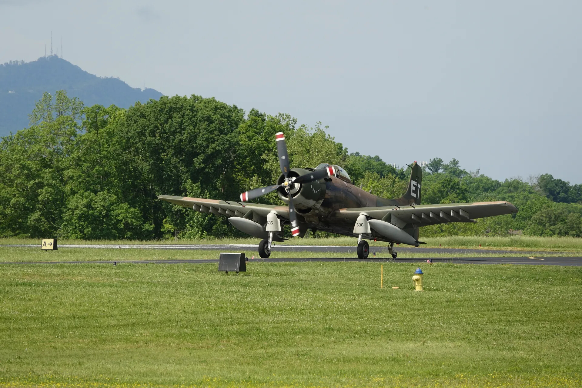 Crew Member in Profile Beside Skyraider Canopy