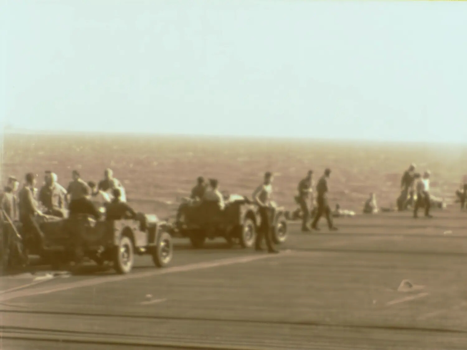 Upscaled Film Still: Jeeps and Crew on Aircraft Carrier Flight Deck (Francis R Ferry Collection)
