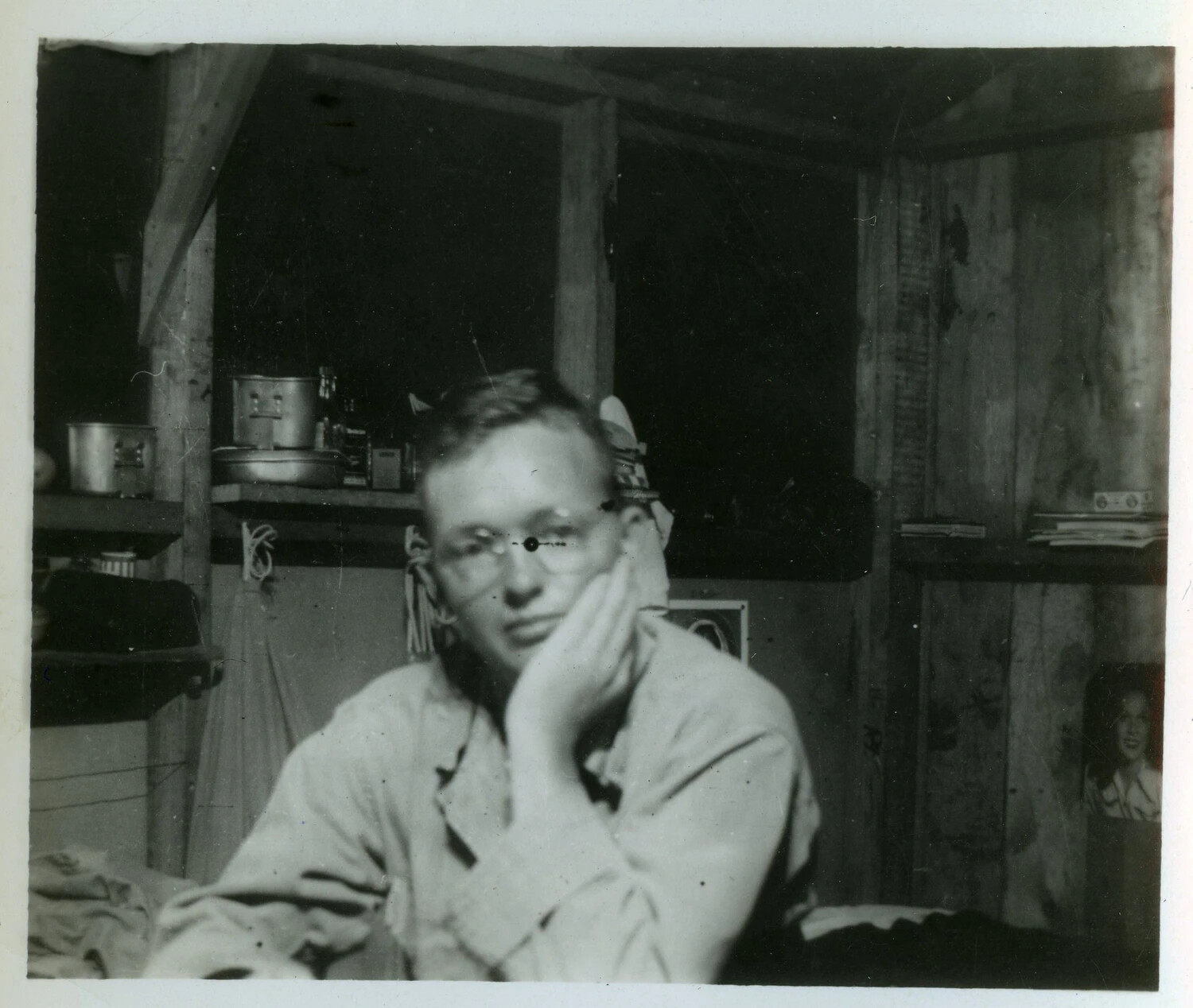 Serviceman with Eyeglasses Resting in Barracks Hut, World War II Pacific Theater