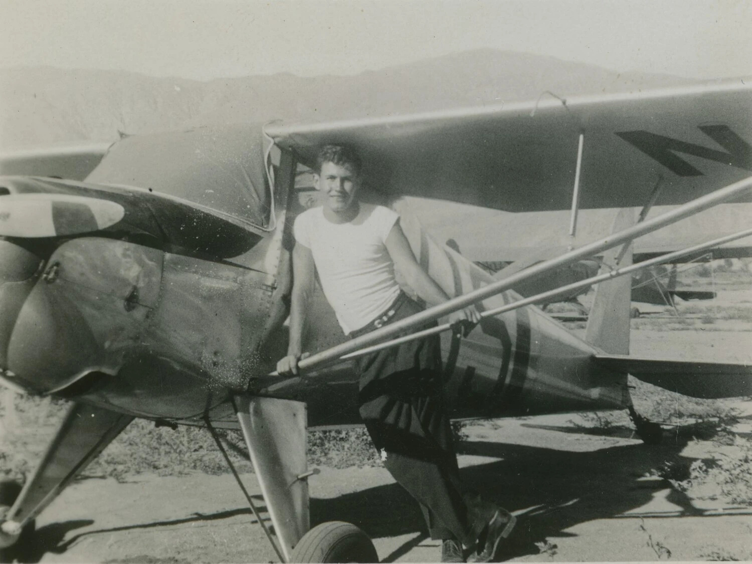 Young Man with Light Civilian Aircraft, McAleer Personal Photo Album