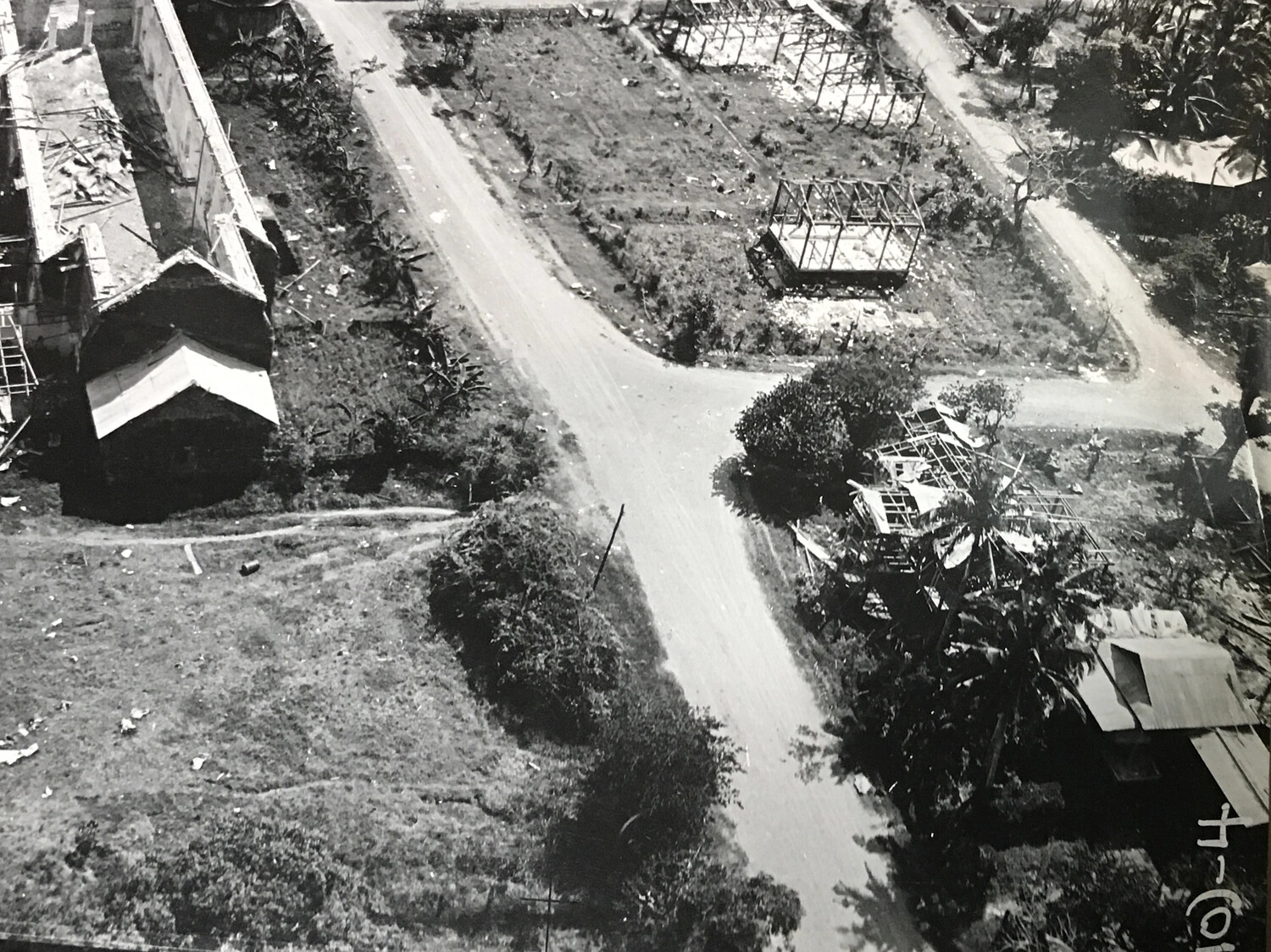 Aerial Reconnaissance View of Bomb-Damaged Village Crossroads, Pacific Theater