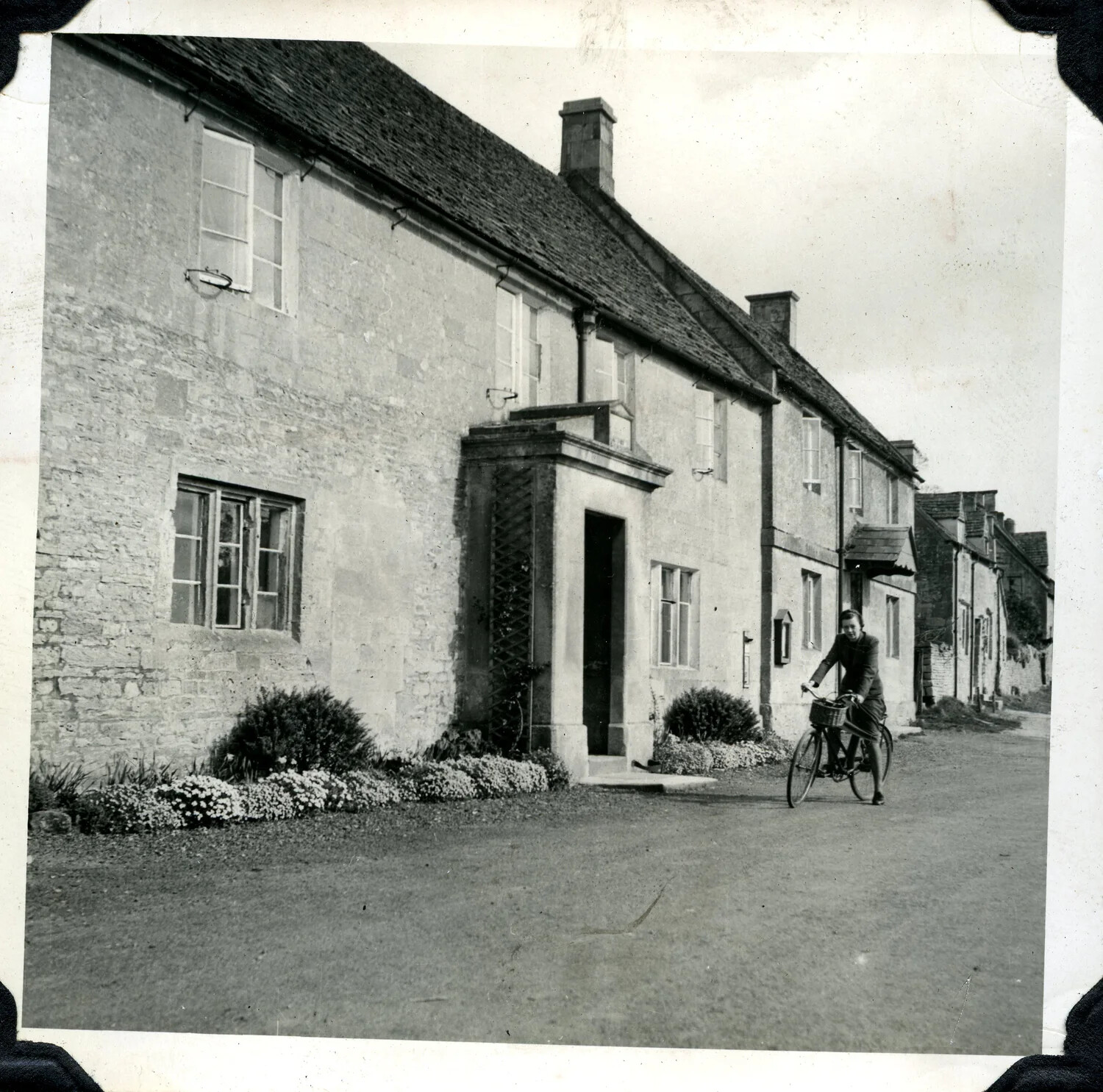 English Village Street Scene with Cyclist, WWII-Era Photo Album (Jervey Signal Corps Collection)