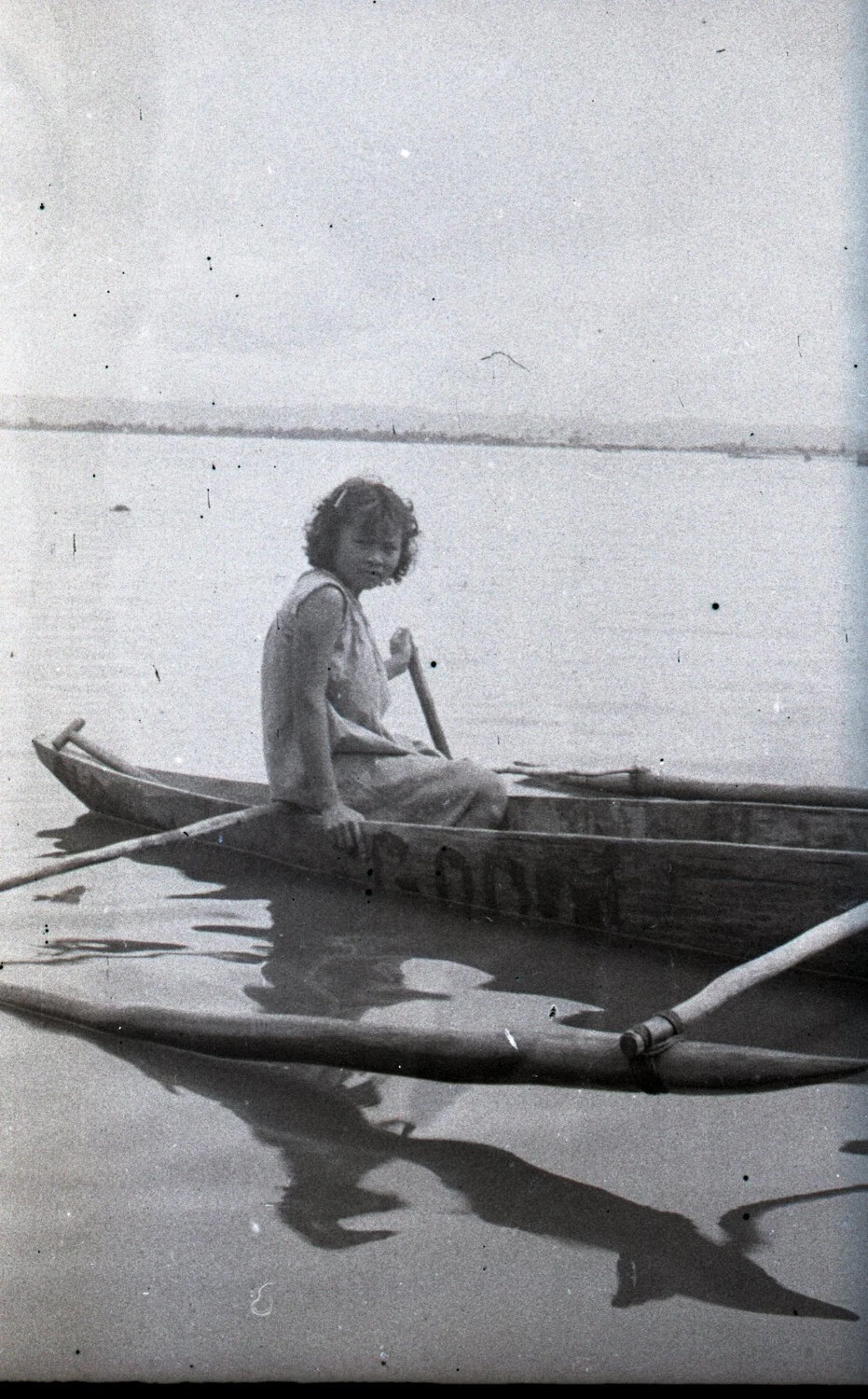 Filipino Girl in Outrigger Banca Boat, Luzon, Philippines, World War II