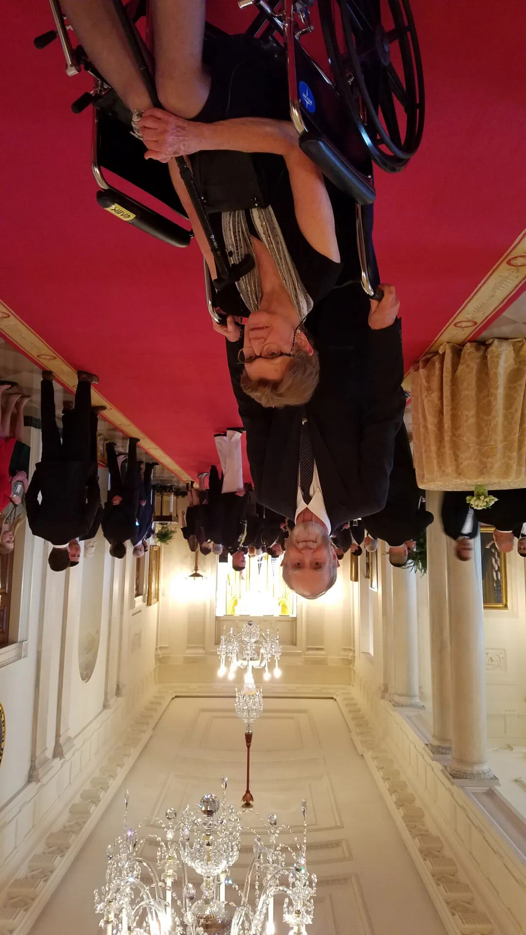 Man and Woman in Wheelchair Posing in White House Corridor, Likely Medal of Honor Ceremony Guests, October 23, 2017