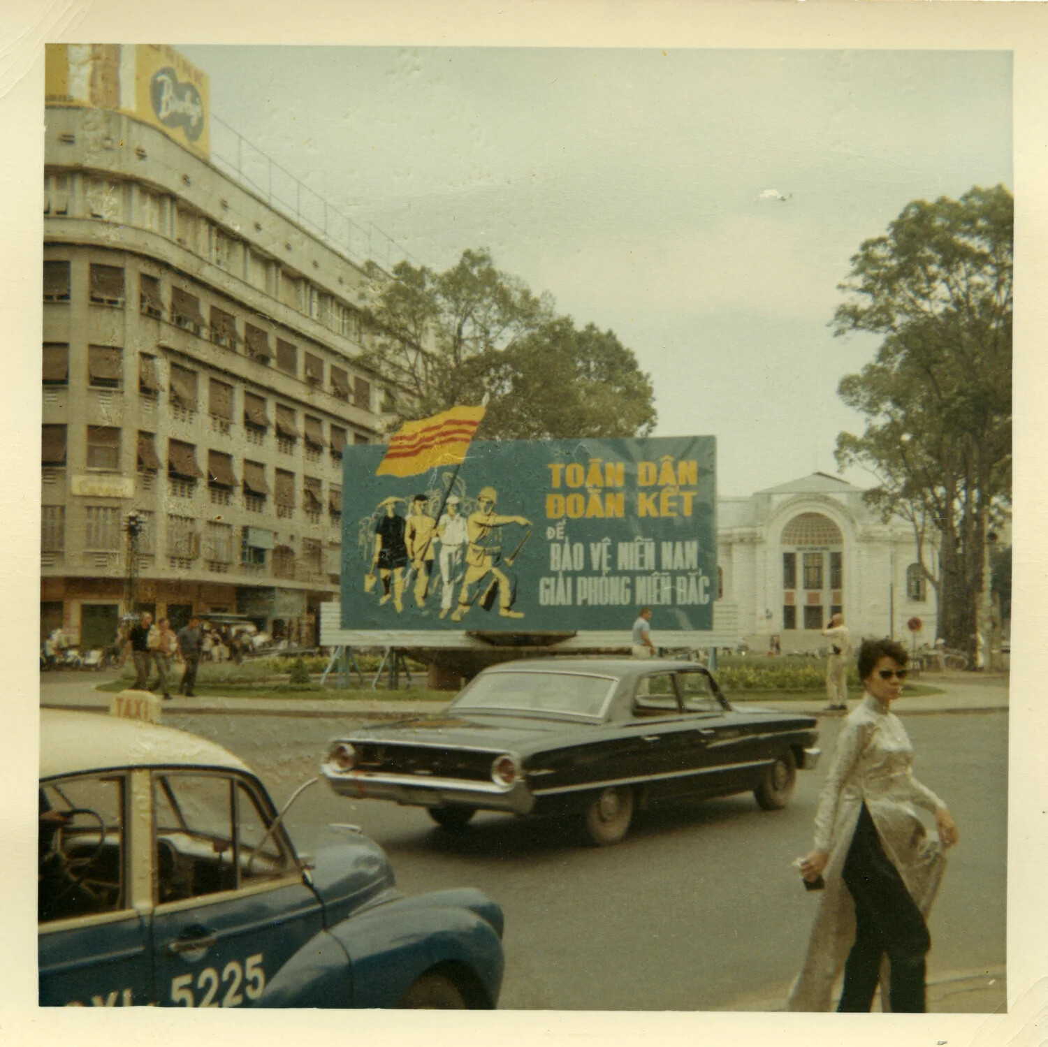 Street Scene with Government Propaganda Billboard, Downtown Saigon, South Vietnam, 1964