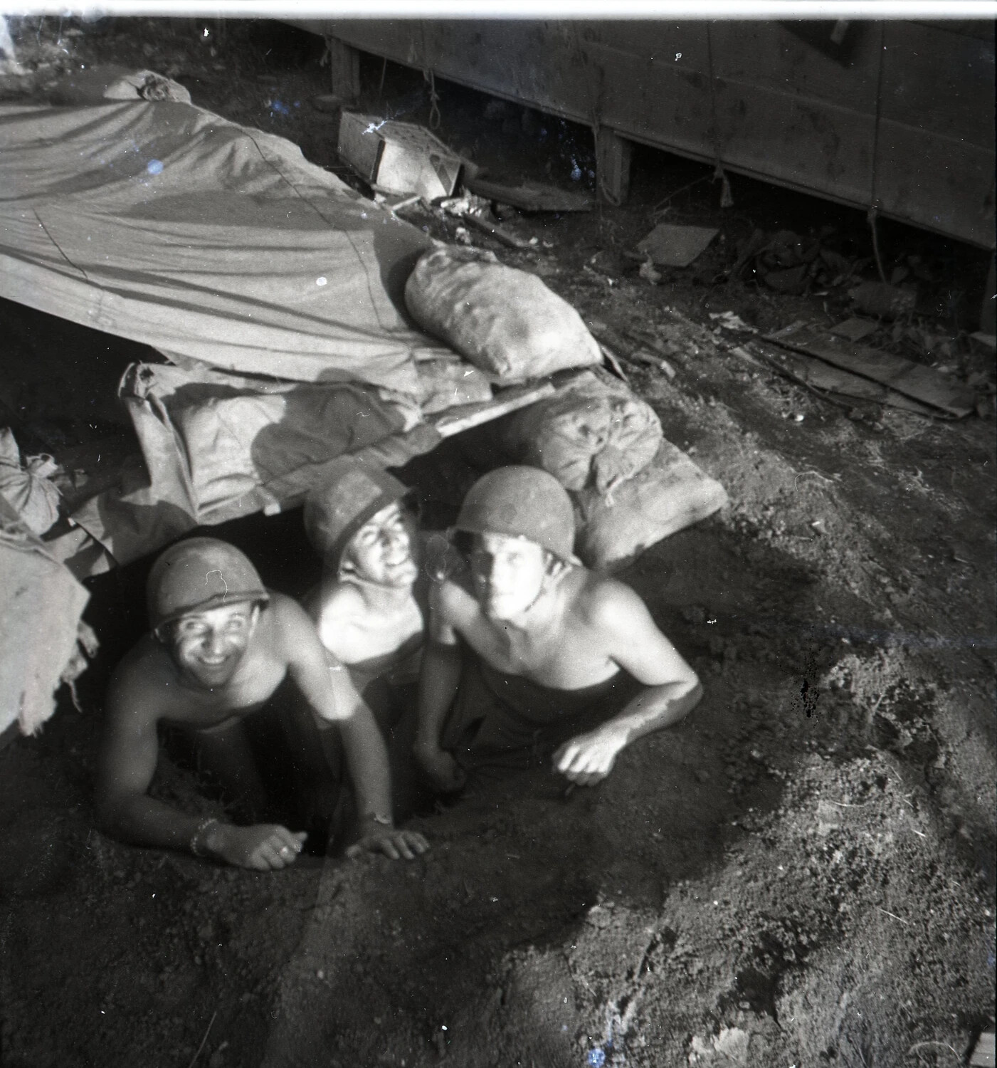 Servicemen in a Sandbagged Foxhole Shelter, Ie Shima, 345th Bombardment Group, WWII