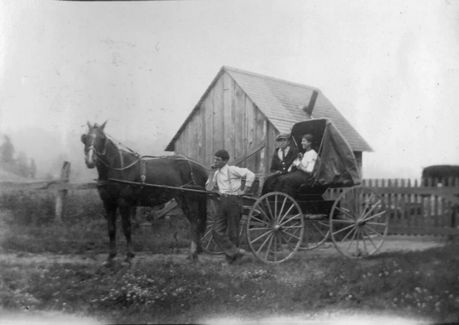Man with Horse and Buggy Carrying Two Passengers