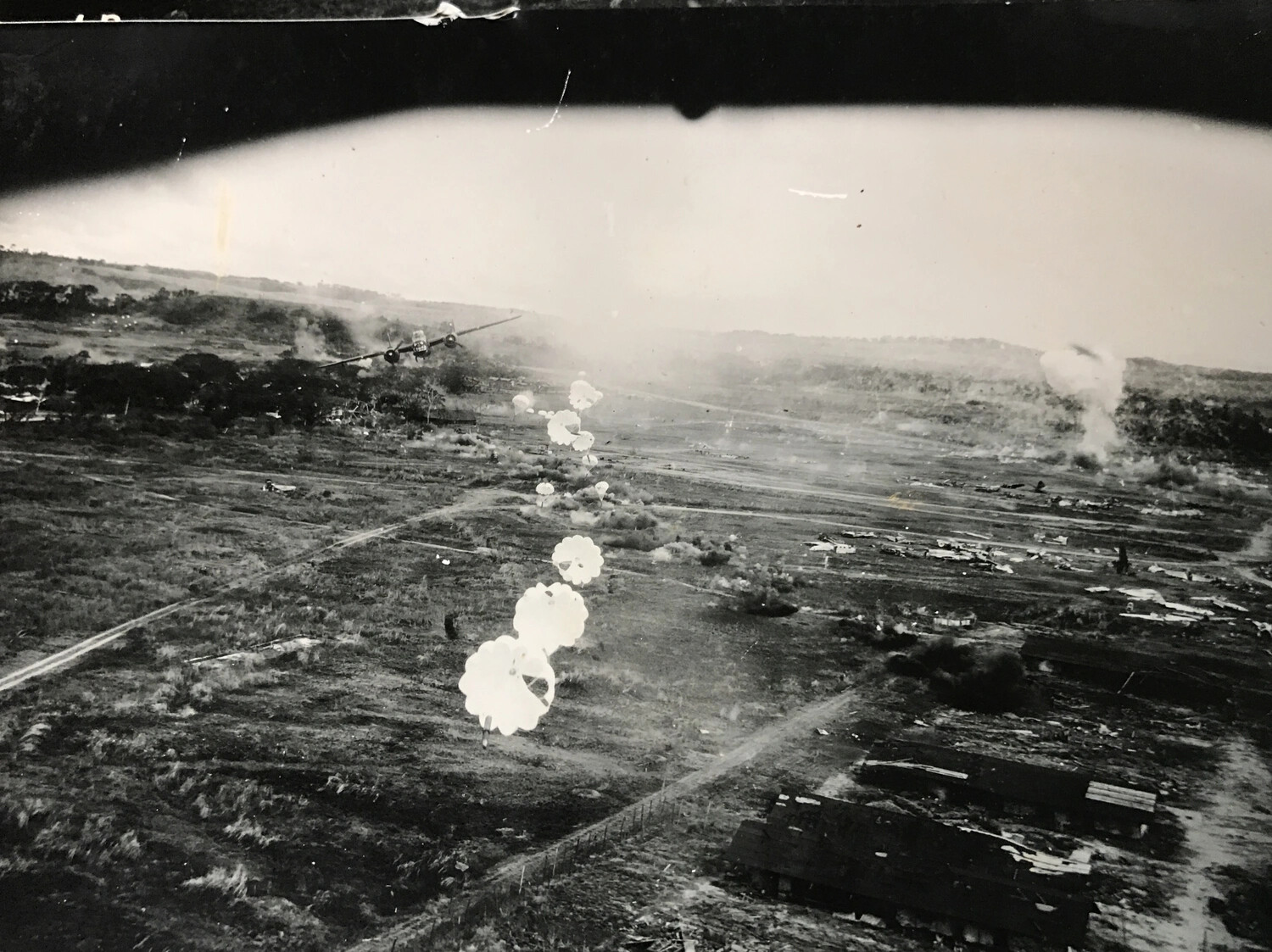 B-25 Mitchell Releasing Parafrag Bomb Train During Low-Level Airfield Attack