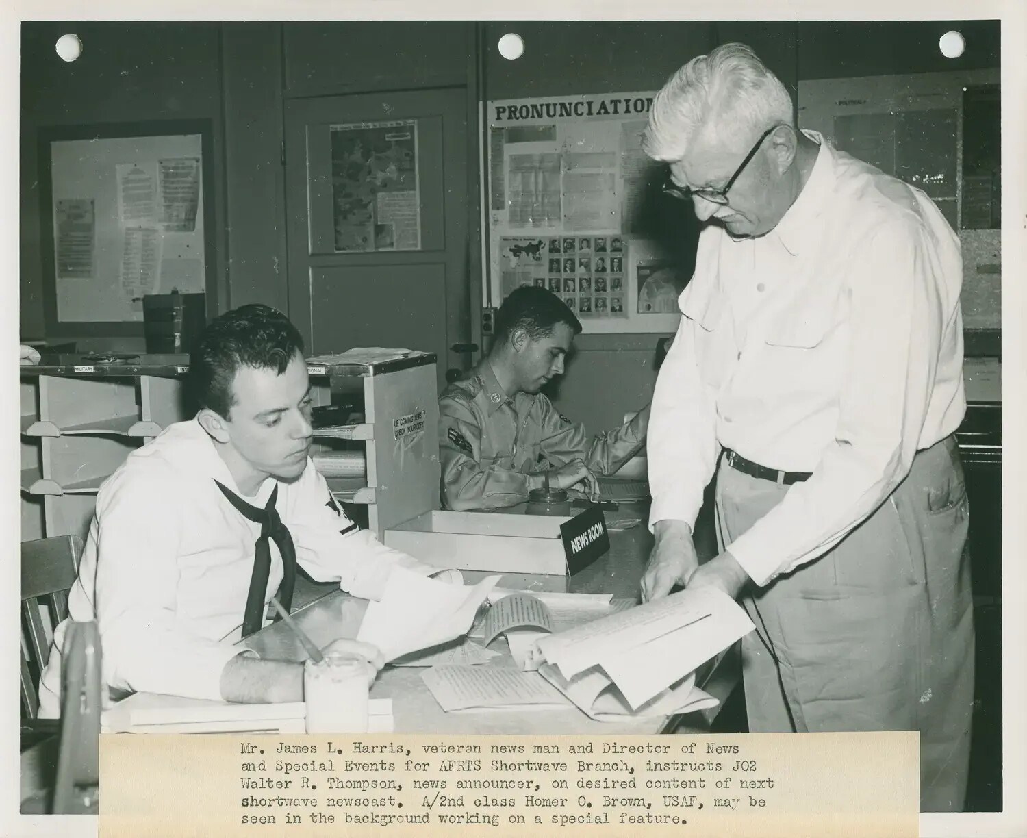 AFRTS Shortwave Branch Newsroom: James L. Harris Instructs JO2 Walter R. Thompson