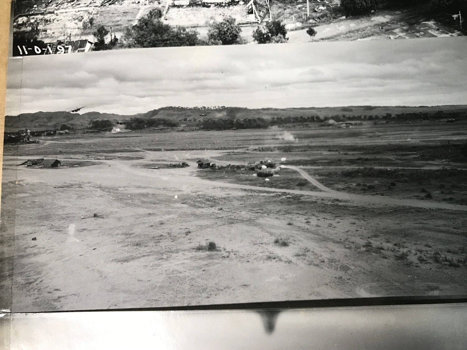 Album Page View: B-25 Mitchells Attacking Ground Target, with Adjacent Aerial Photo and Handwritten Negative Number