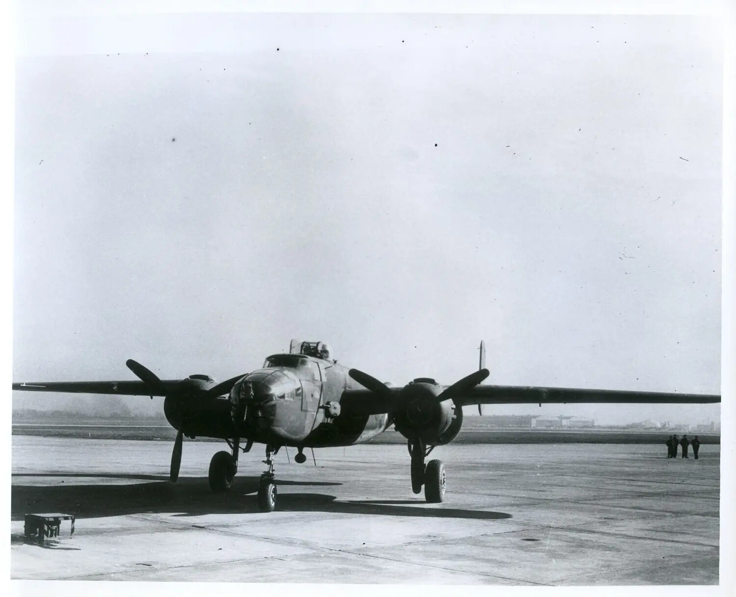 Twin-Engine U.S. Military Bomber (Likely Douglas A-26 Invader) on Airfield Ramp