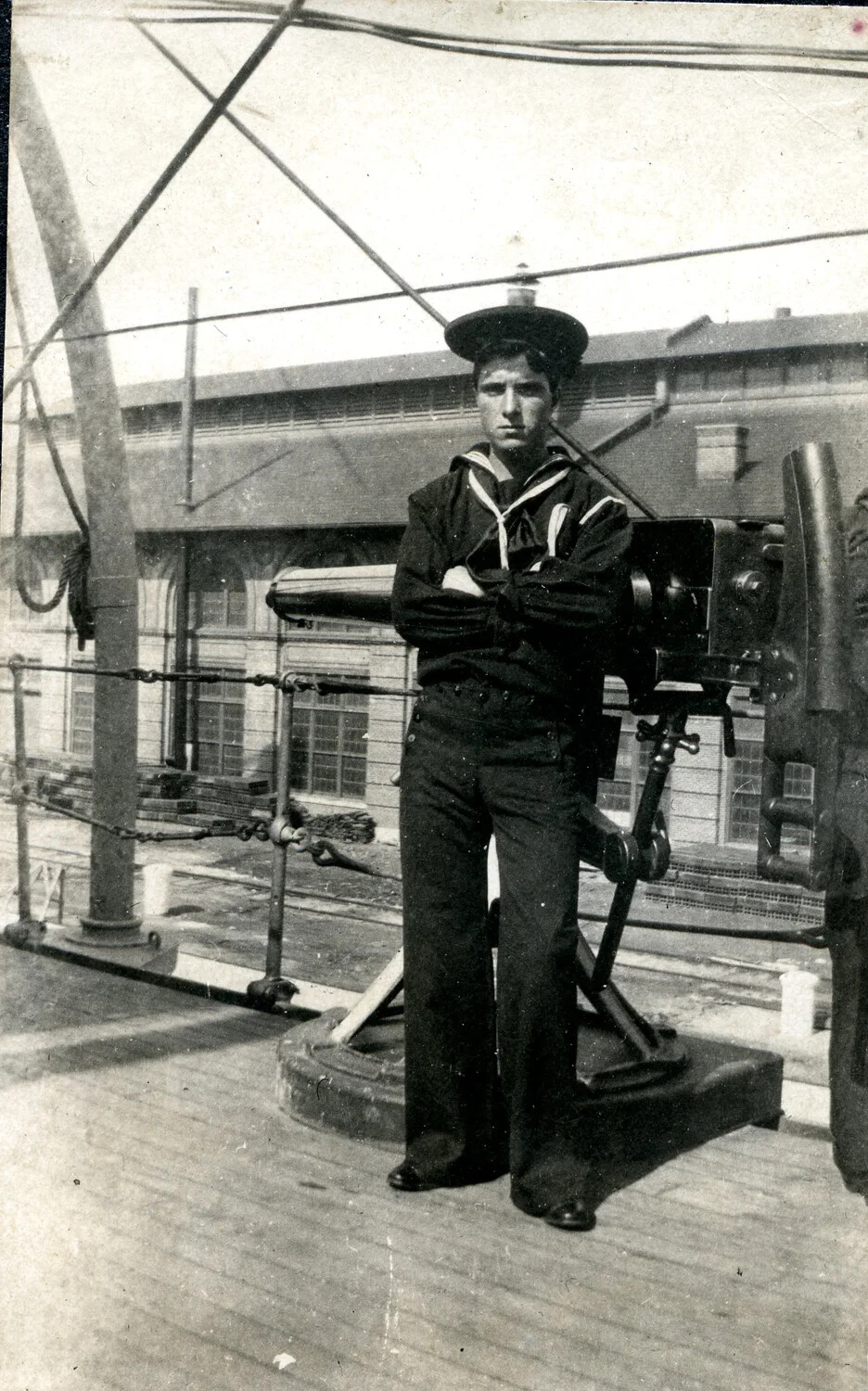 Bluejacket Posing Beside Shipboard Rapid-Fire Gun, Navy Yard, c. 1900s