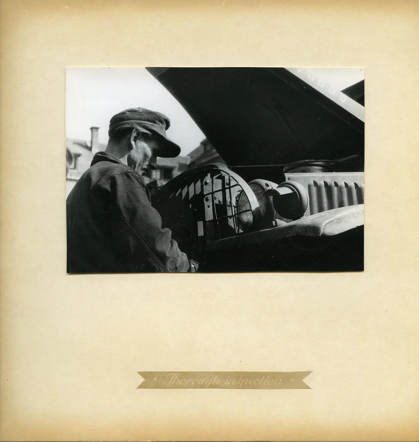 Mechanic Inspecting Truck Headlamp Assembly, Depot Vehicle Maintenance Album Plate