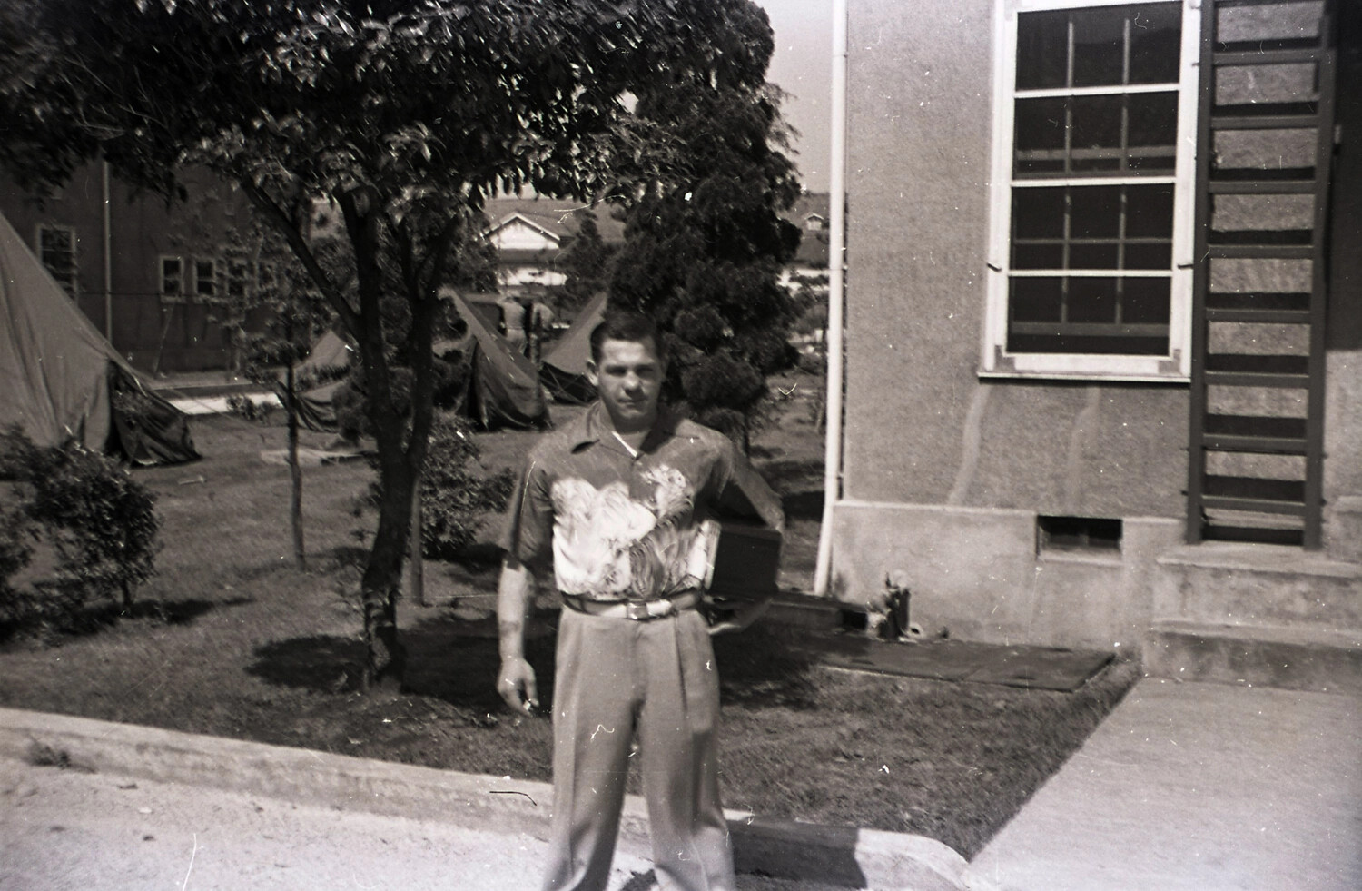 Soldier with Box Camera in Camp Yard, 187th Airborne Regimental Combat Team Collection, Korea Era