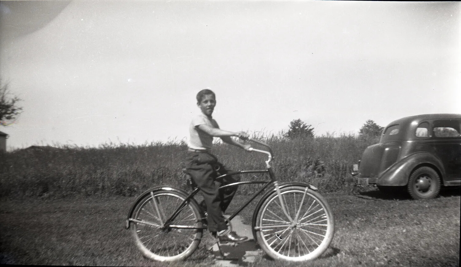 Boy on Bicycle with Vintage Automobile, Rural Snapshot