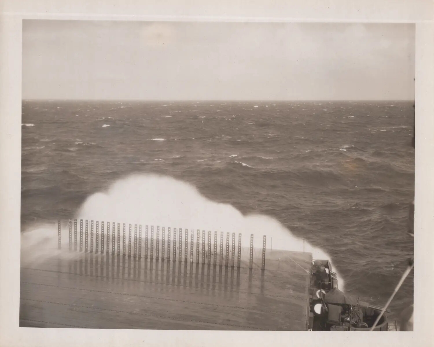 U.S. Navy Escort Carrier: Flight Deck and Bow Awash in Heavy Seas, WWII Pacific Theater