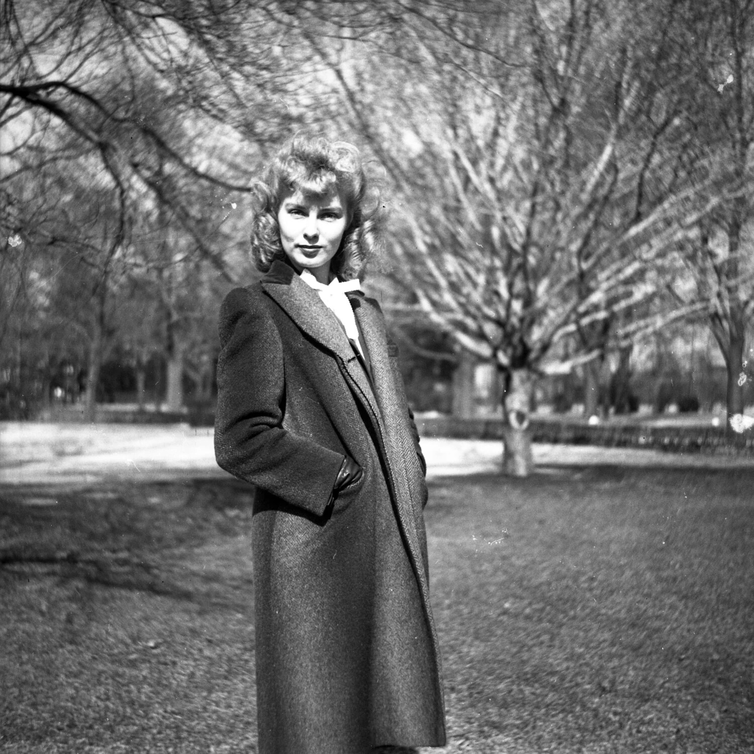 Young Woman in Herringbone Coat, Tree-Lined Park Path - Portrait Series