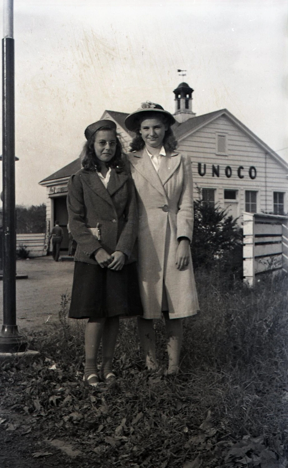 Two Young Women Posing at Sunoco Station, New Hampshire, WWII Era