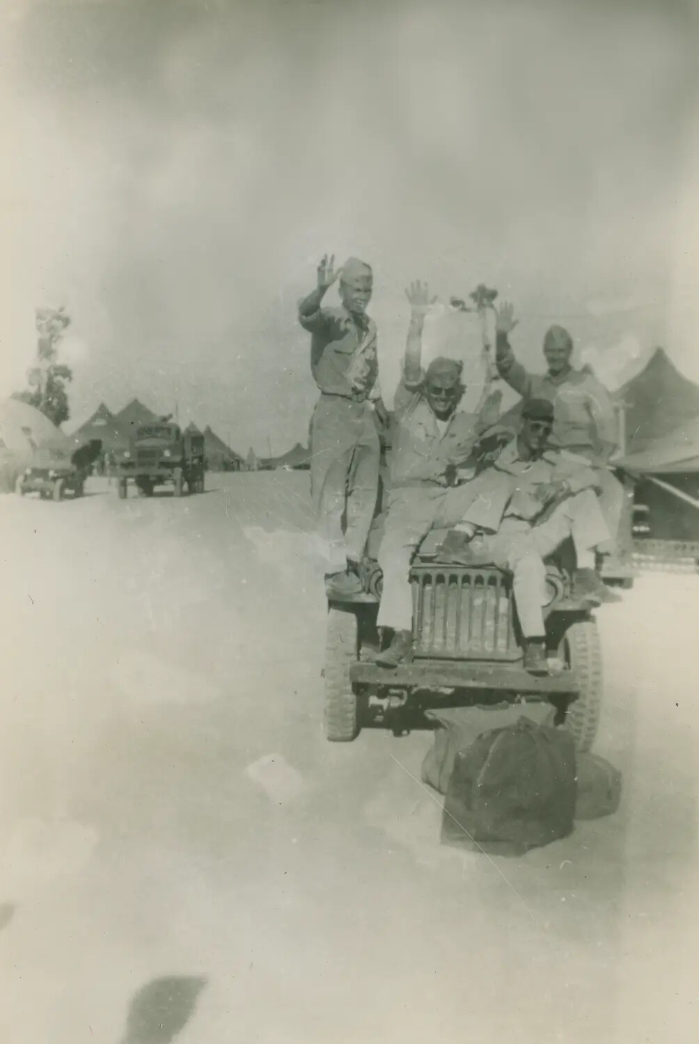 Servicemen Celebrate Atop a Jeep, WWII Tent Camp, Edward P. McAleer Album