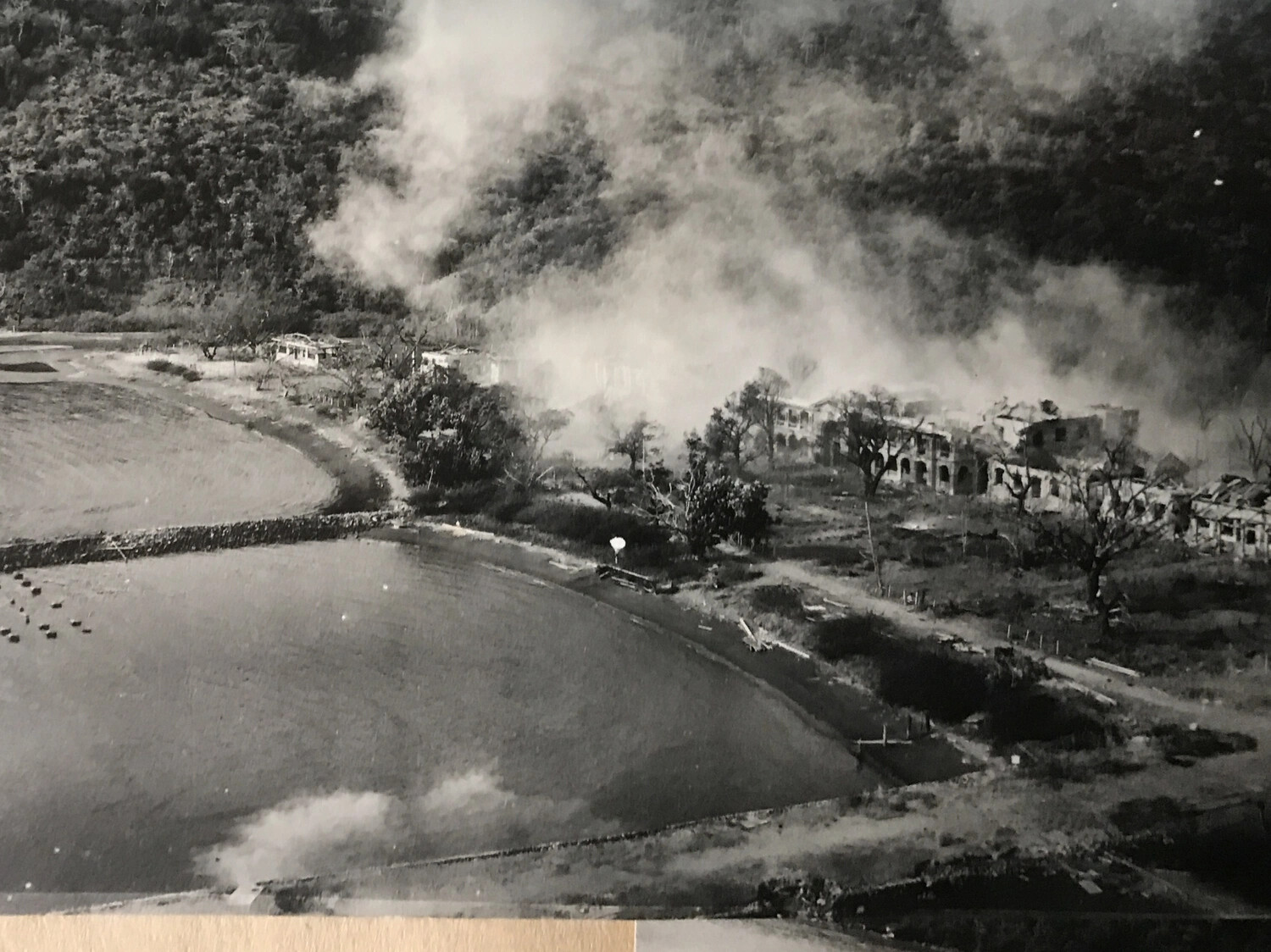 Aerial Strike Photograph: Burning Masonry Building Complex with Smoke Cover, Pacific Theater, WWII