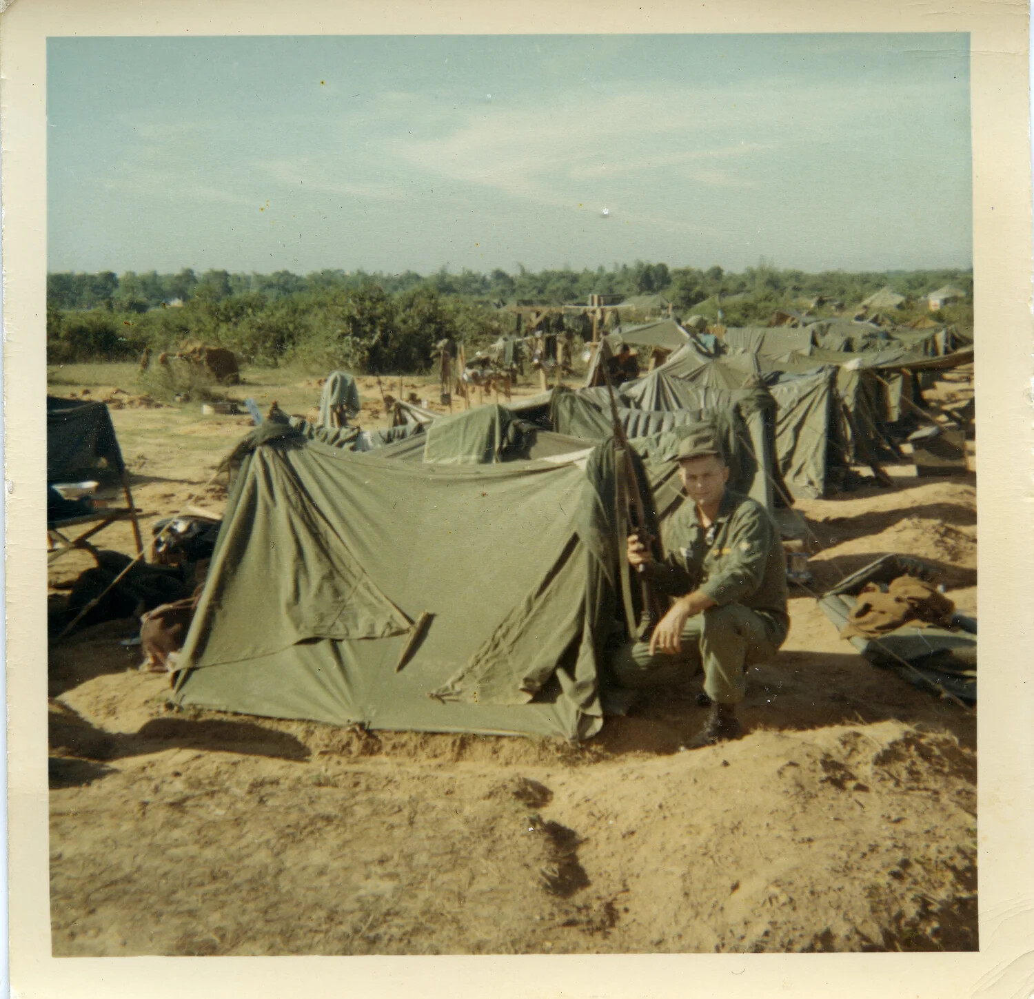 U.S. Serviceman Beside Shelter-Half Tent at a Field Encampment, Vietnam, 1964
