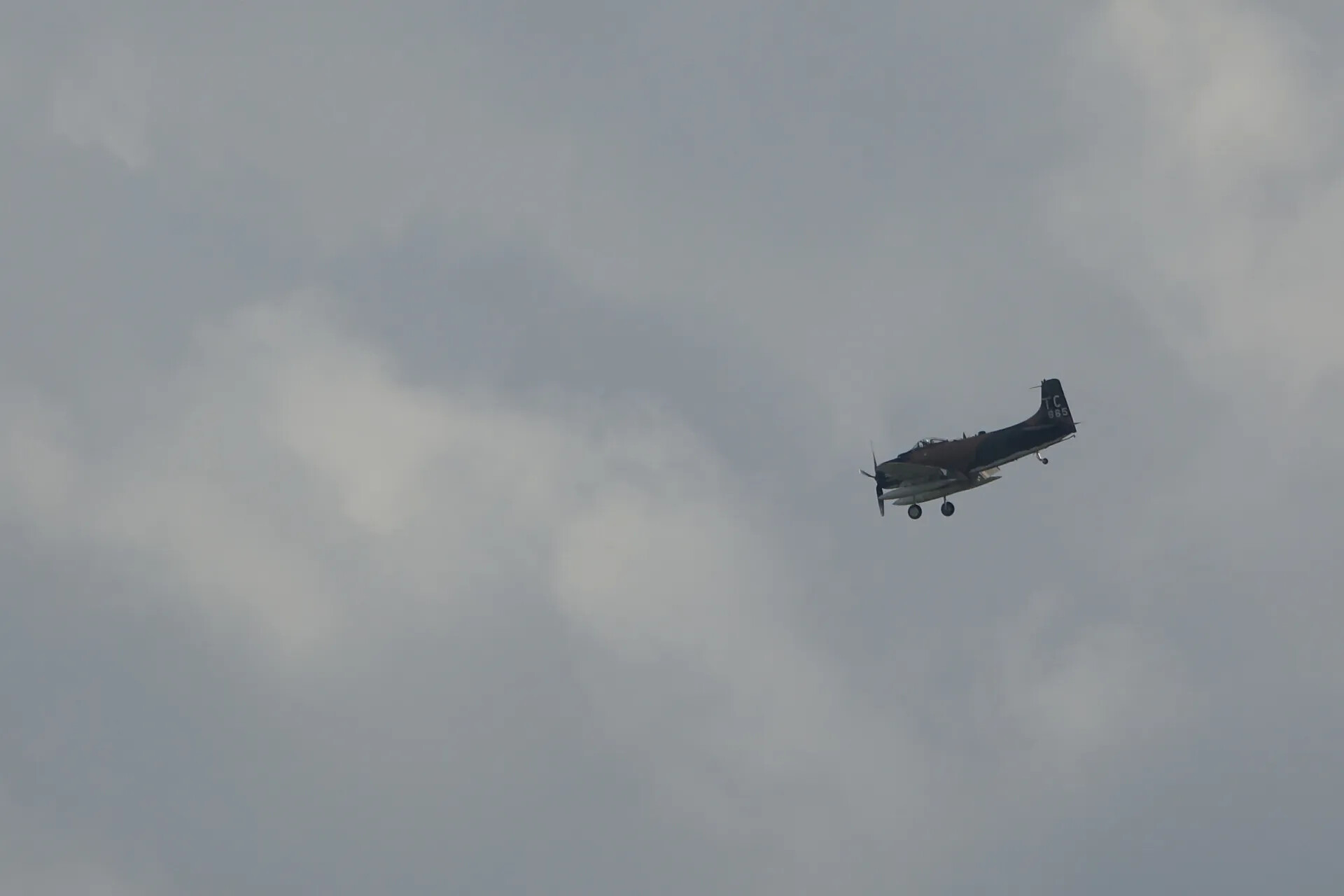 A-1 Skyraider in Flight Against Overcast Sky, Tail Code TC 965