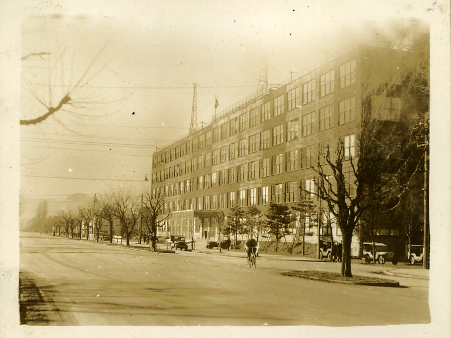 Multi-Story Building with Rooftop Radio Towers, Japanese City Street, Postwar Era