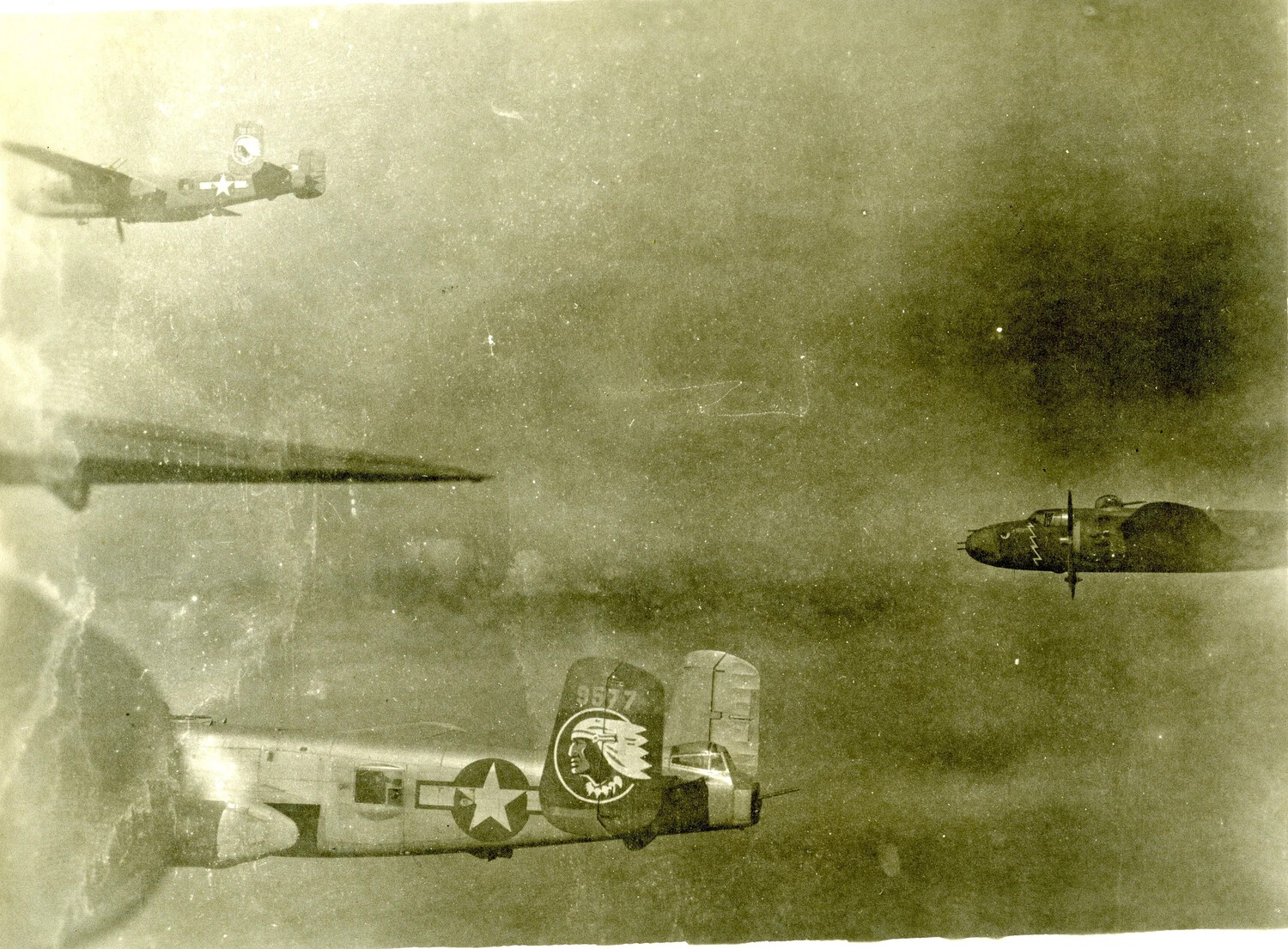 B-25 Mitchell Formation in Flight with 498th Bombardment Squadron Indian-Head Tail Marking, Pacific Theater, 1945