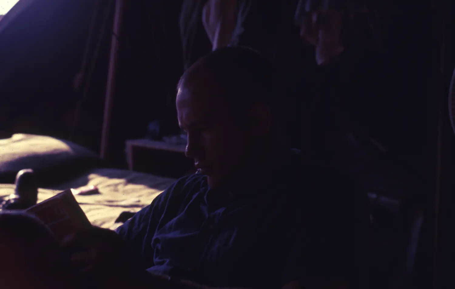 Vietnam War Era Color Slide: Serviceman Reading in Low-Light Tent Interior, Vietnam