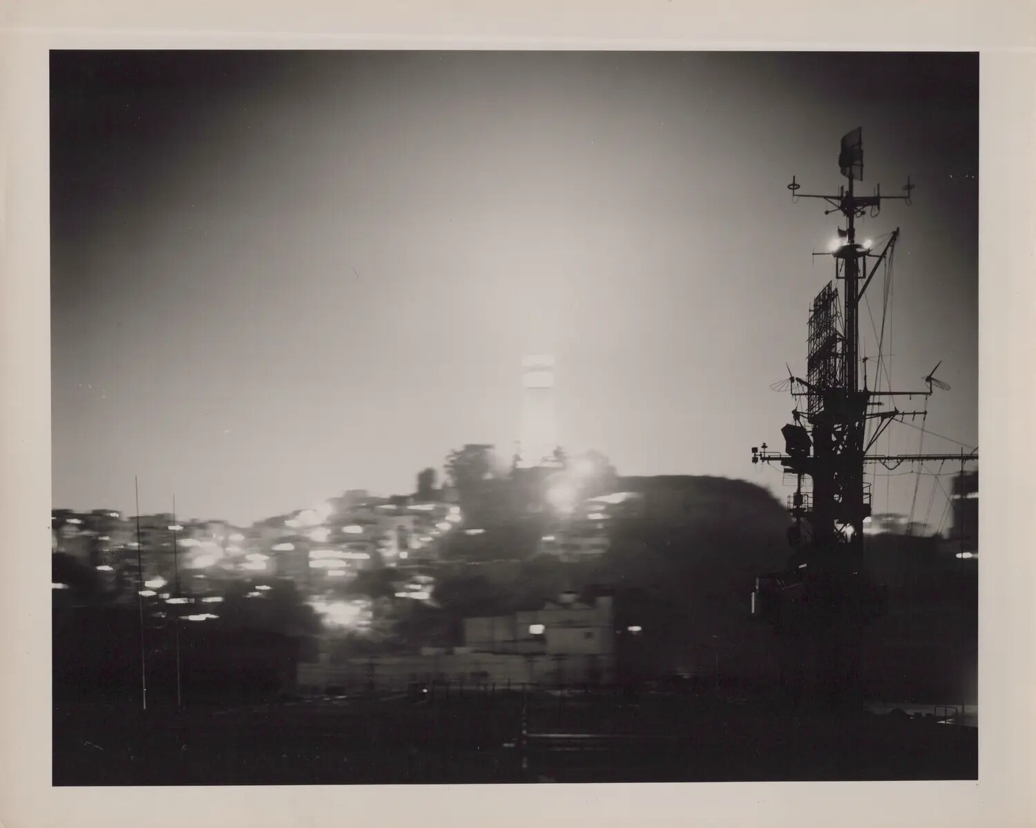 Night View of City Skyline from Ship's Deck, Possibly San Francisco Bay