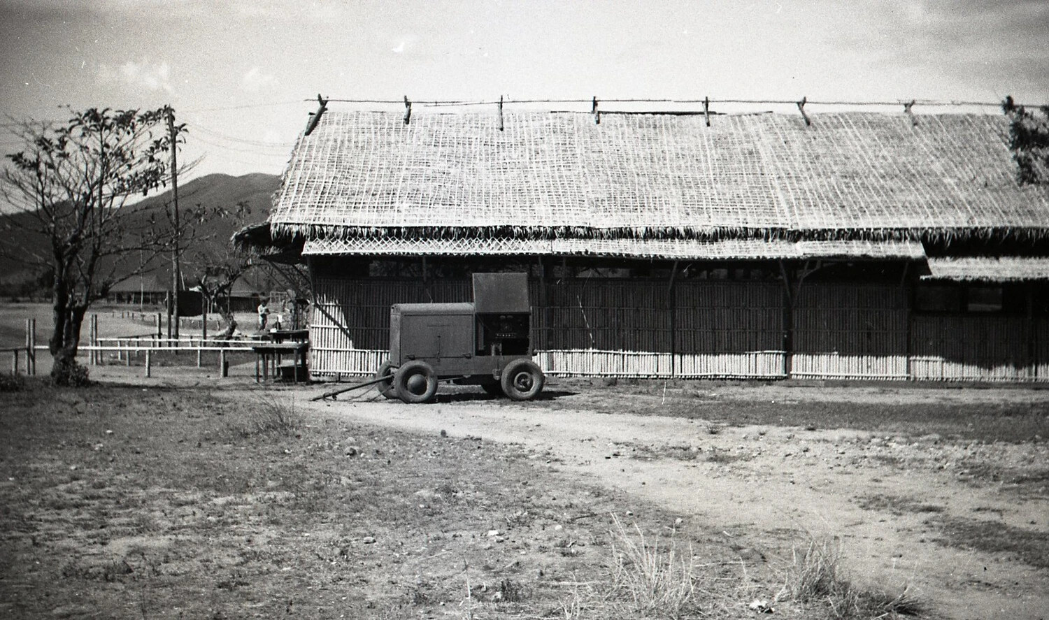 Military Building with Woven Roof and Mobile Generator Unit, Luzon, Philippines, WWII Era